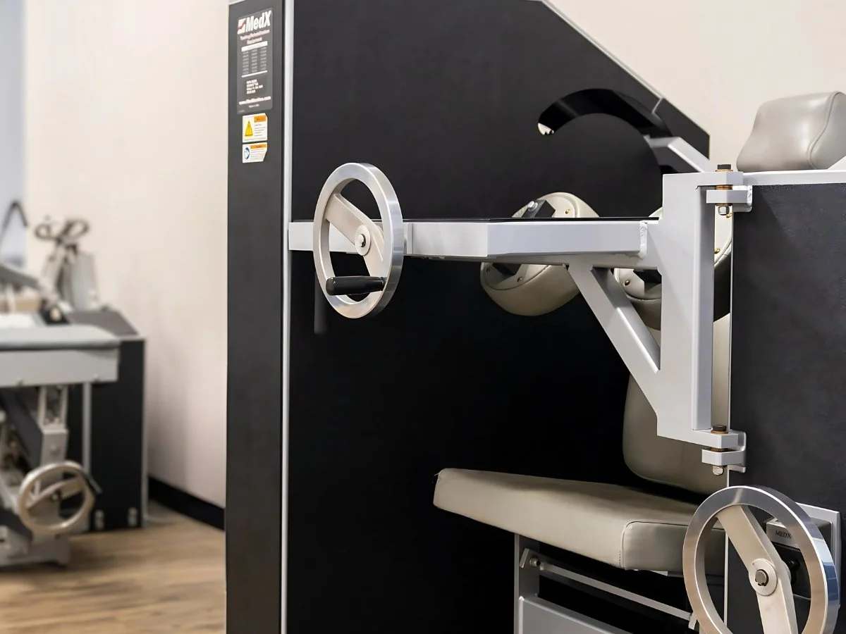 Cervical MedX machine used for whiplash injury treatment at Axis Chiropractic and Massage West Valley City Utah