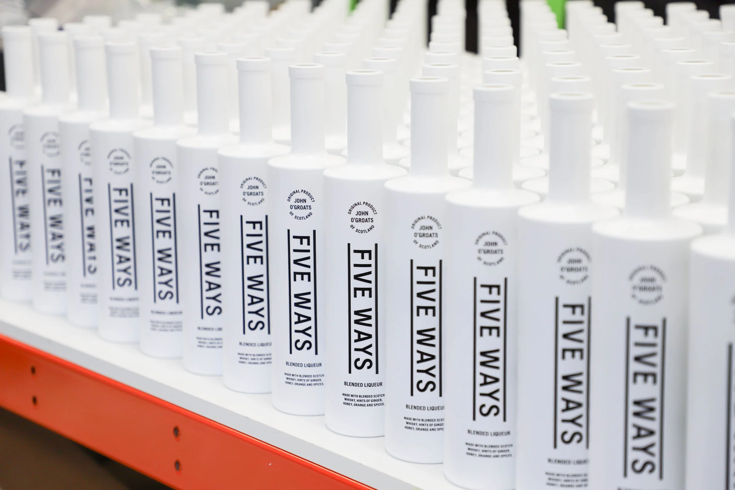Printed black and white liqueur bottles