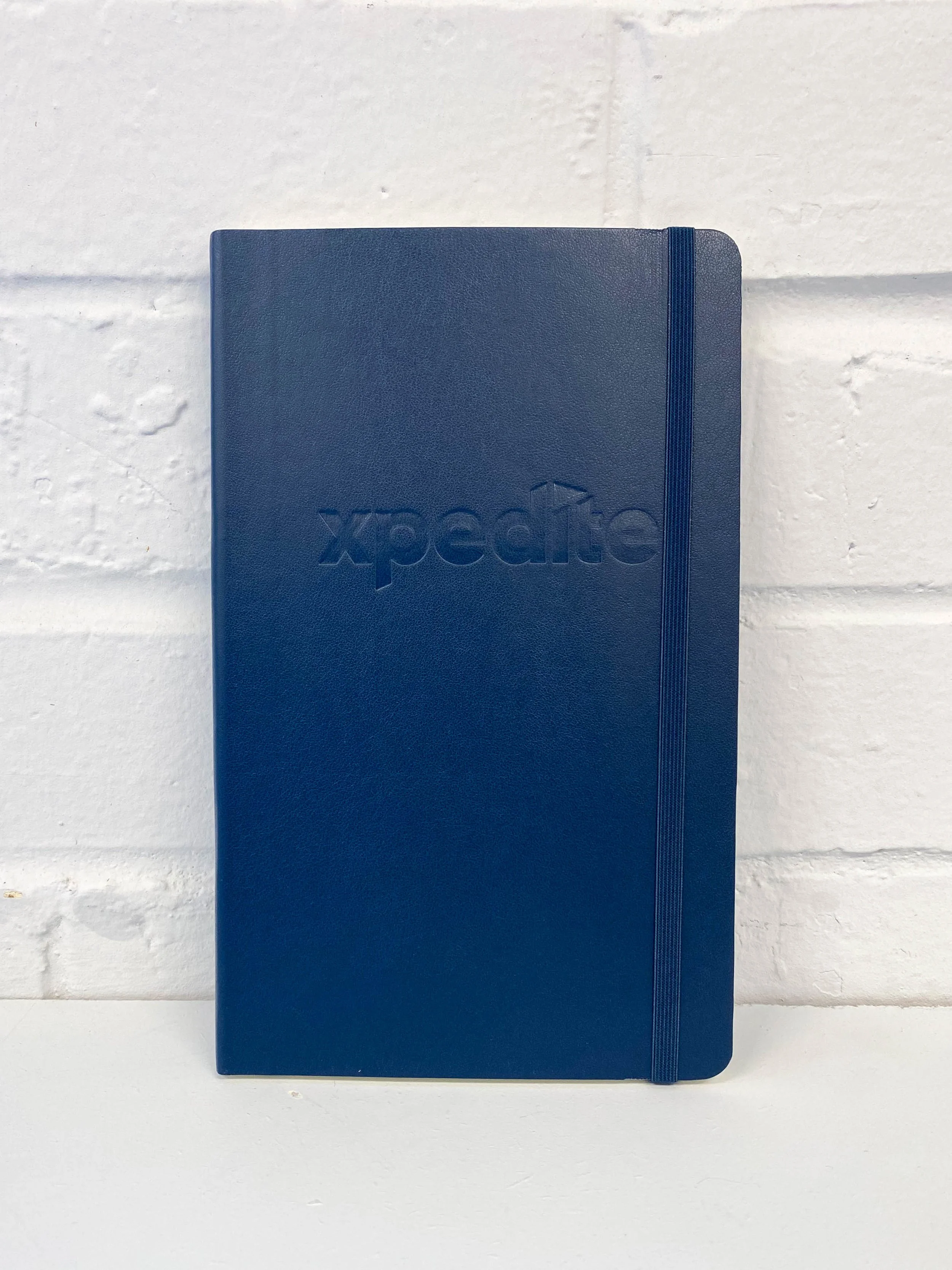 Navy notebook with debossed logo