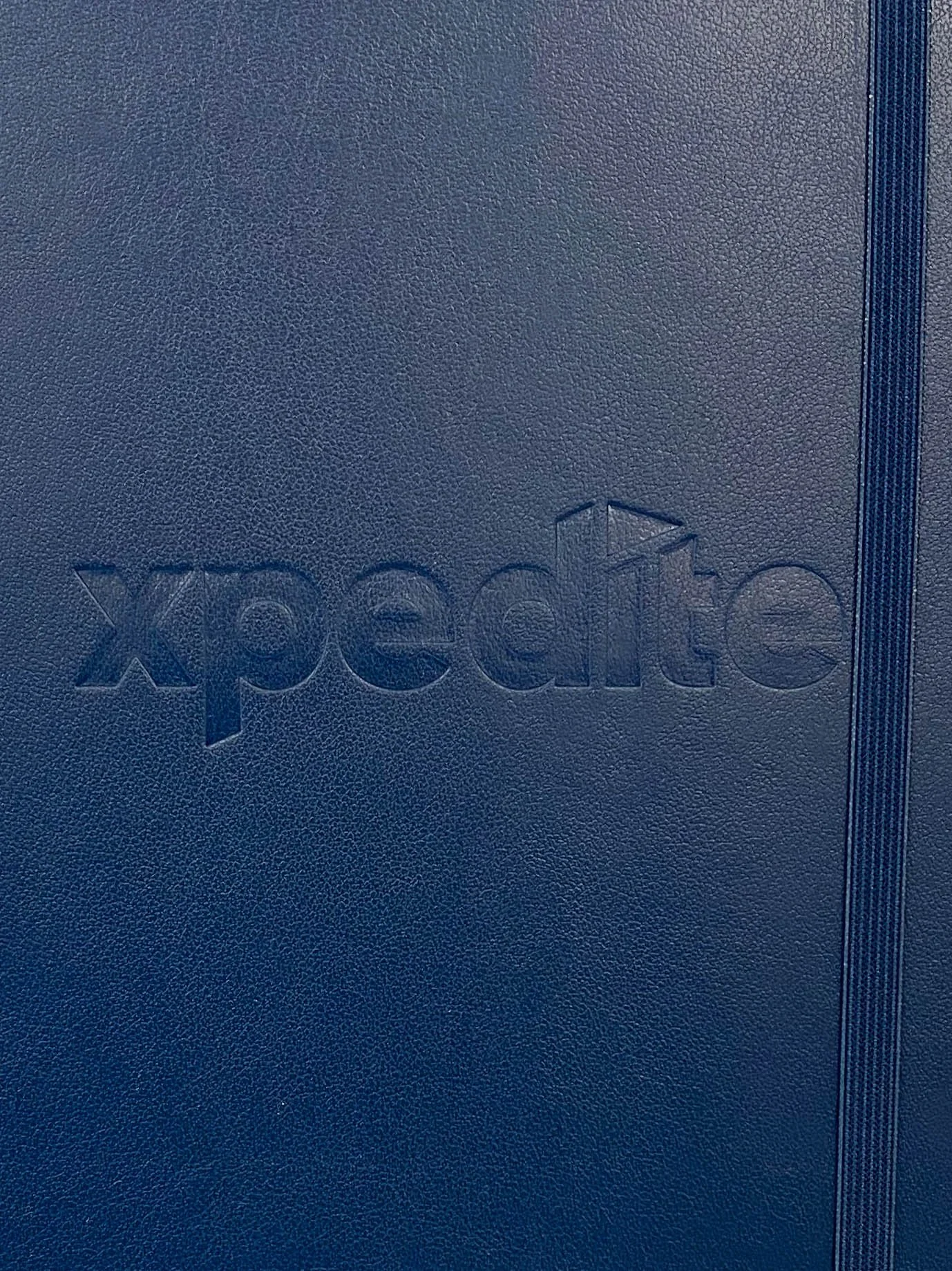 Navy notebook with debossed logo