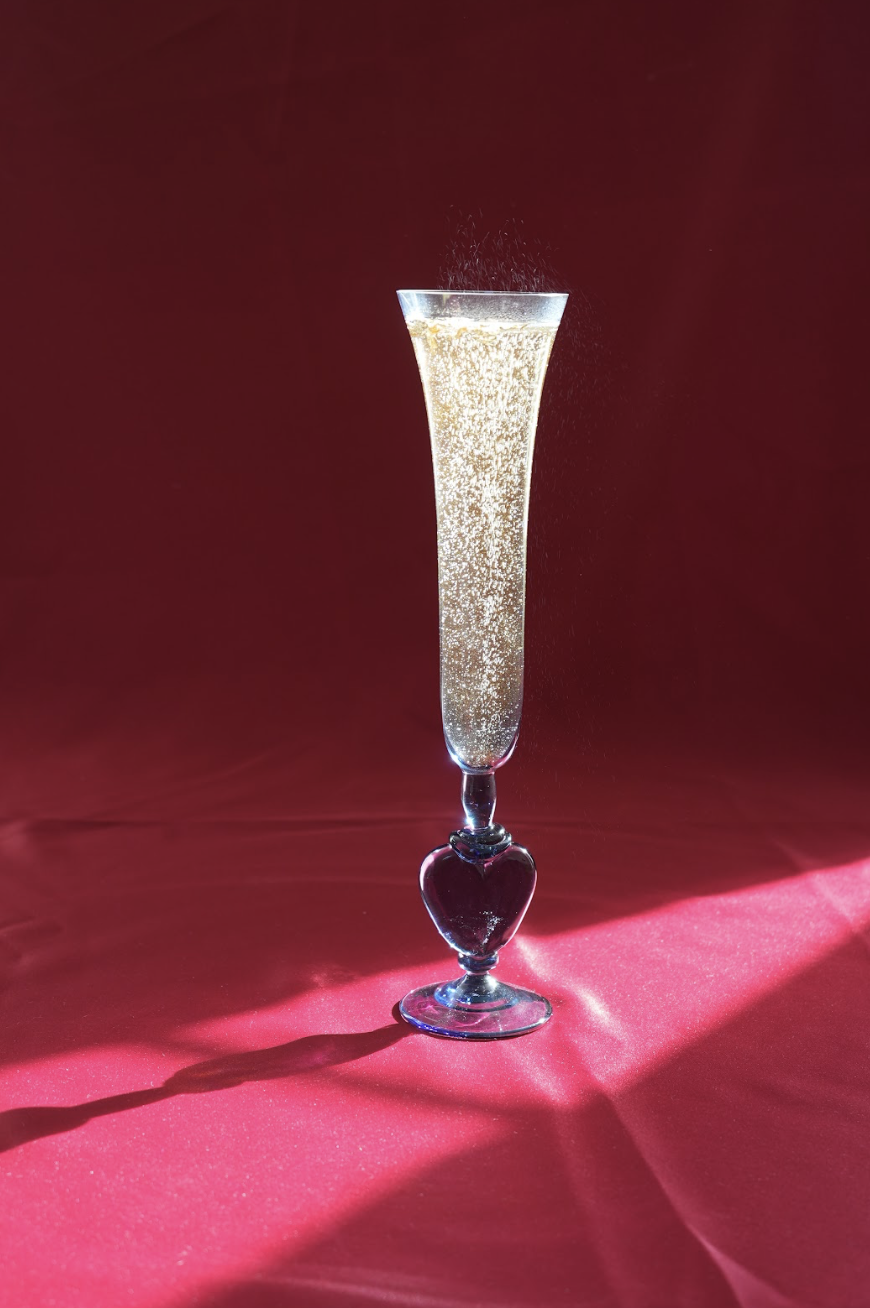 A pair of champagne flutes with heart