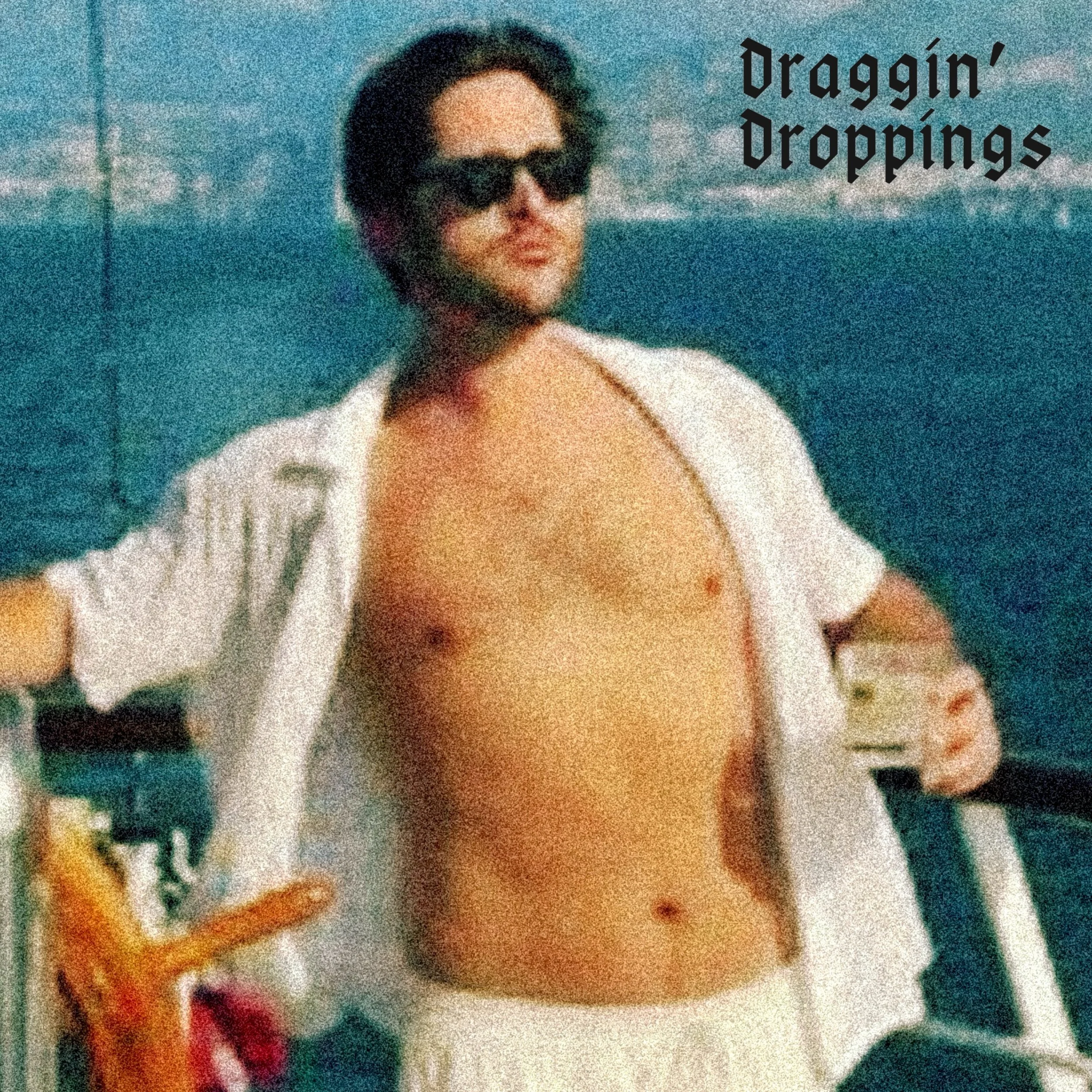2yng2smpl holds drink shirtless at the command of a large ship at sea