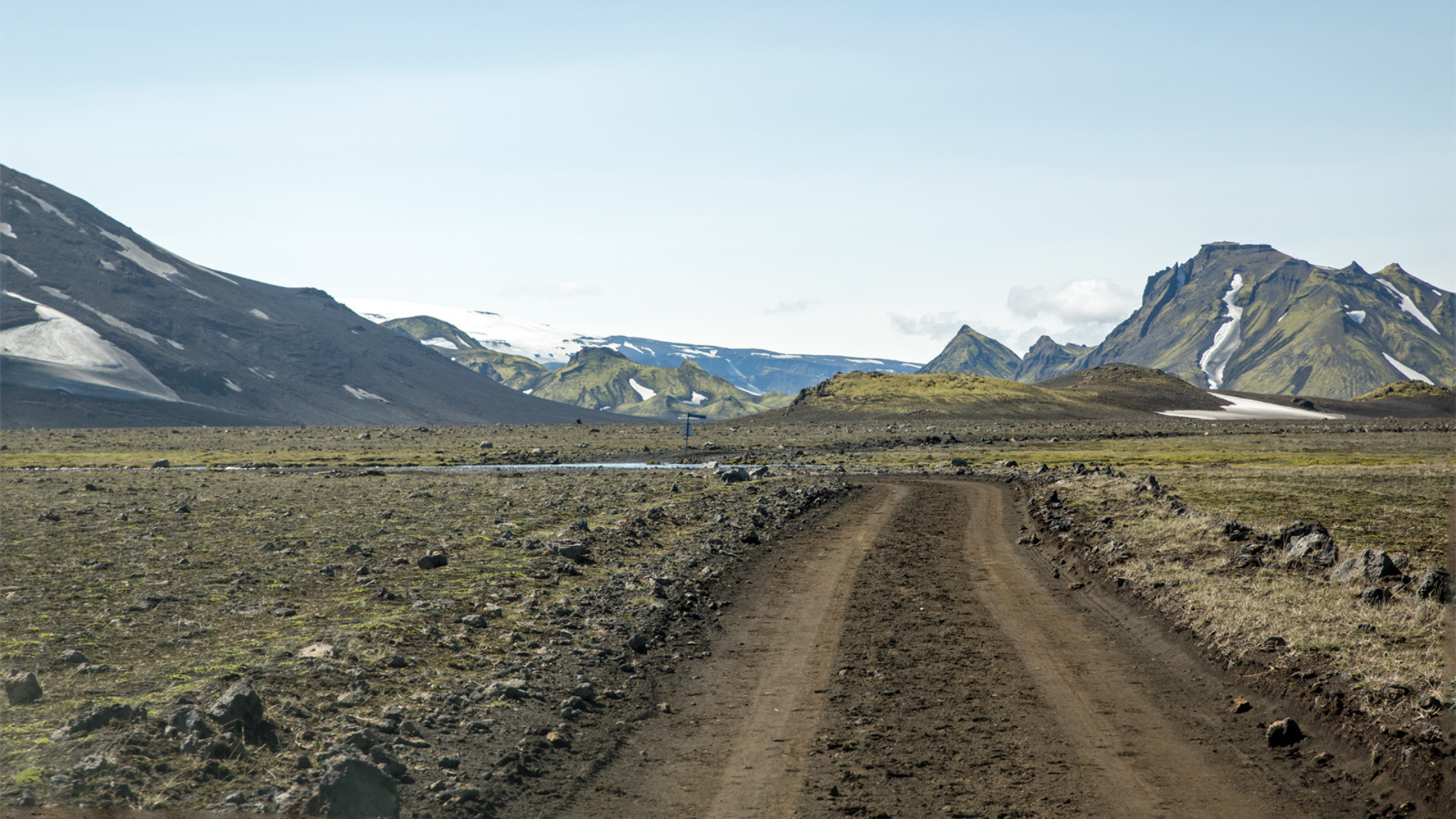 Highland road across black sands toward Mælifell