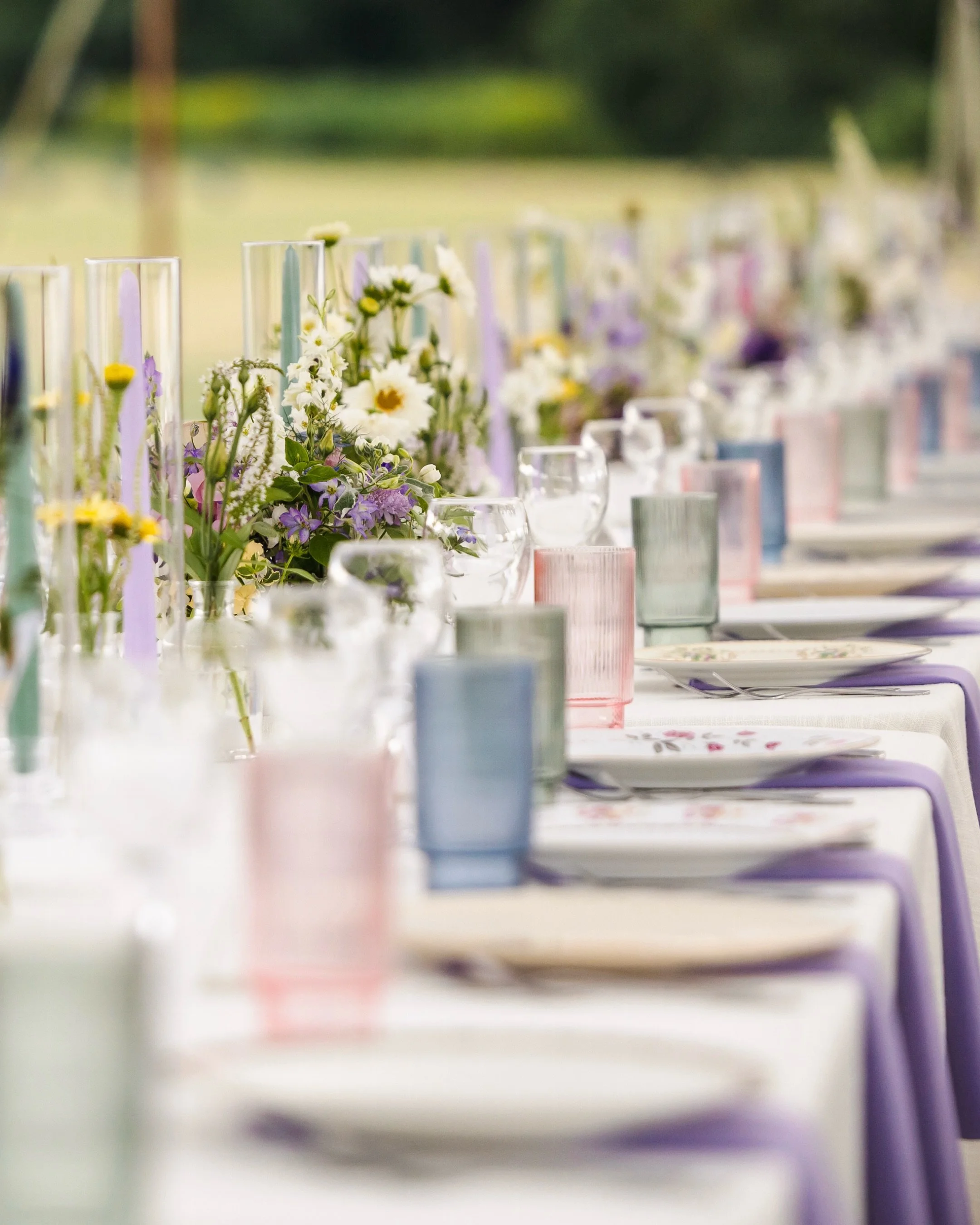 Designing for a tent on Lake Winnipesaukee meant embracing the setting while bringing in plenty of color and personality 💜

For Jesse + AJ, we pulled inspiration from all the hues of hydrangeas - blues, purples and greens with pops of pink - then la