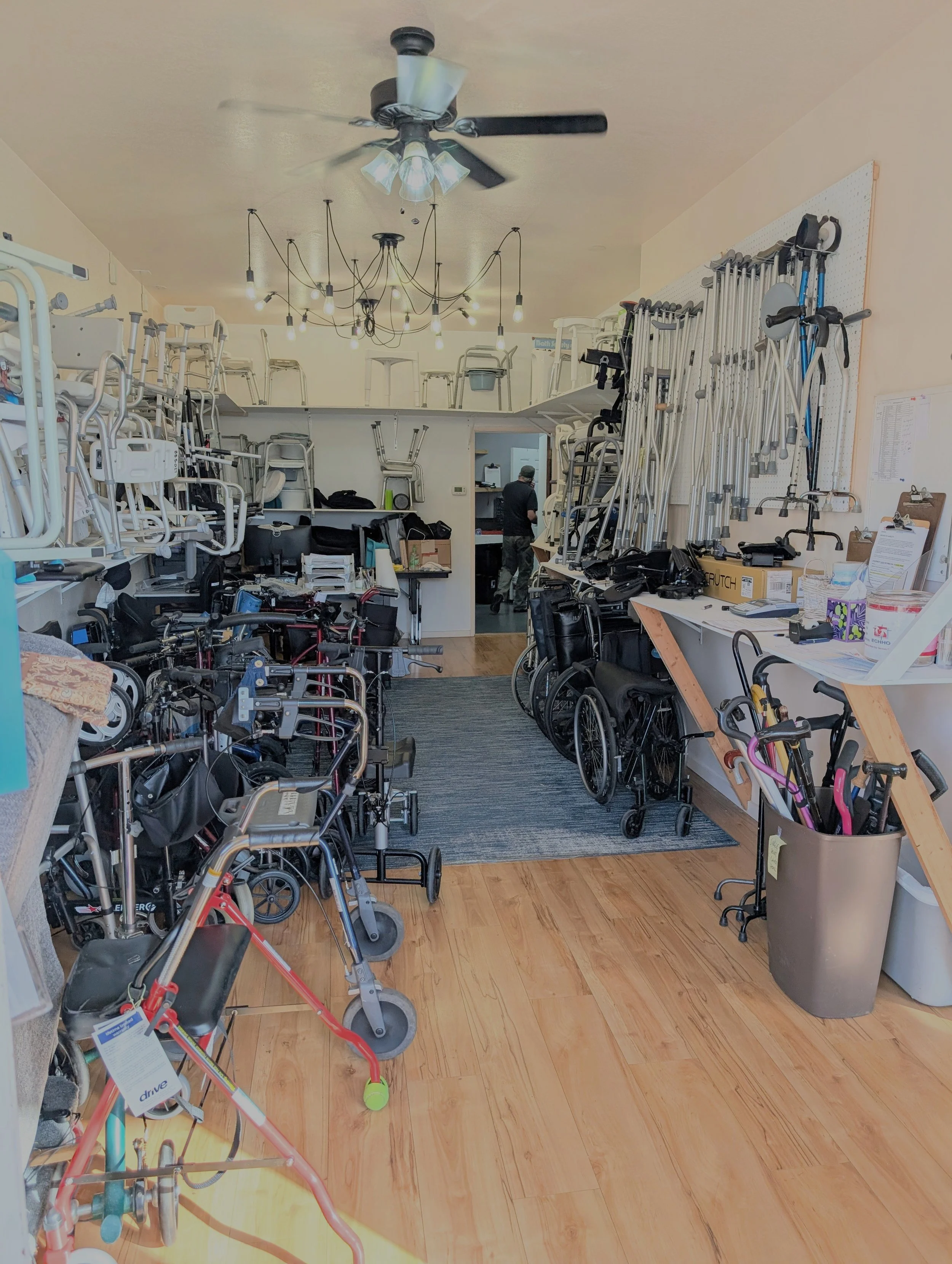View of interior of our shop at 2326 Washington Street, this photo shows our equipment arranged carefully in vertical storage, as well as on the floor. There is a walking path.