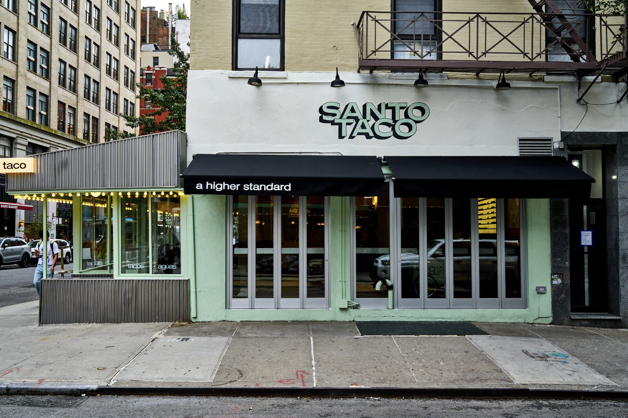 Hand painted exterior signage for Santo Taco in Union Square, New York City, designed by Polonsky and Friends and executed by Remont Studios.