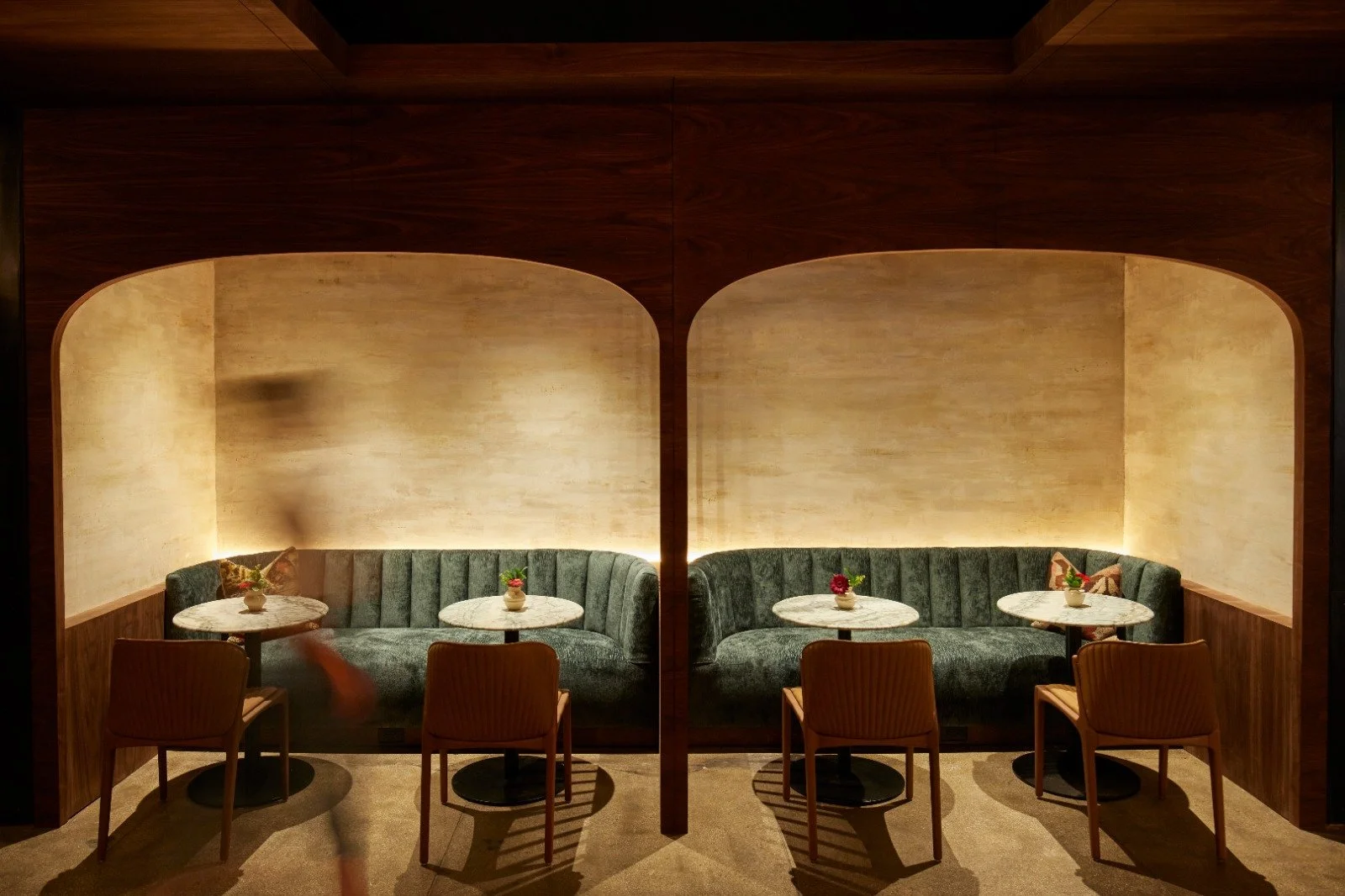 Custom plaster finish within illuminated seating alcoves at NeueHouse Madison Square in New York City, by Remont Studios.