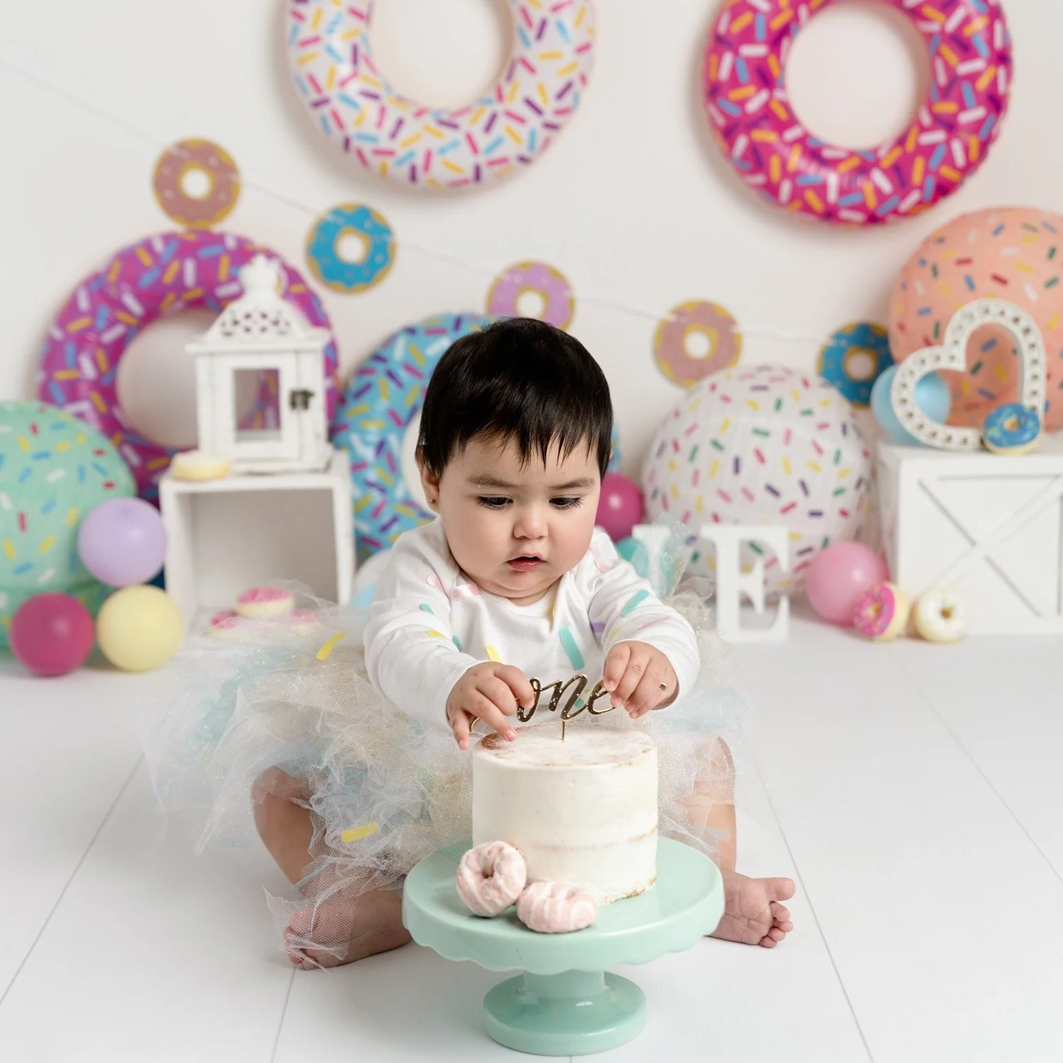 This cake smash ended up being perfect!  Mom had ordered an outfit, but there was a delivery issue and it didn't make it.  She decided to make this &quot;Sweet One's&quot; outfit instead. She did an awesome job, plus it made the session even more spe