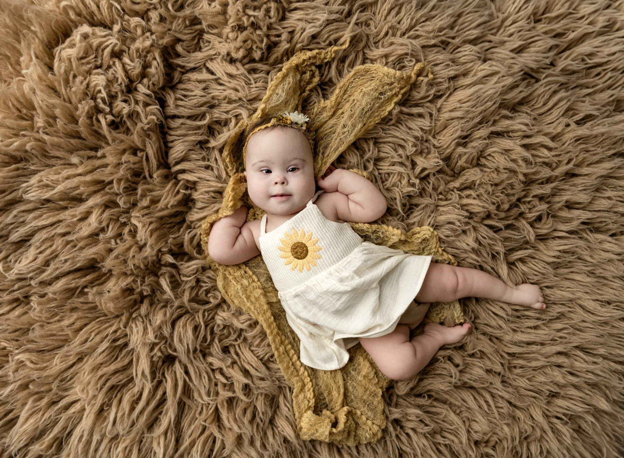 It's been almost a year since this little angel was in the studio.  She was just in for her milestone session recently.  She has had a rough year, but is now doing well.  Not only that, but she was in the best mood for her session and smiled the whol