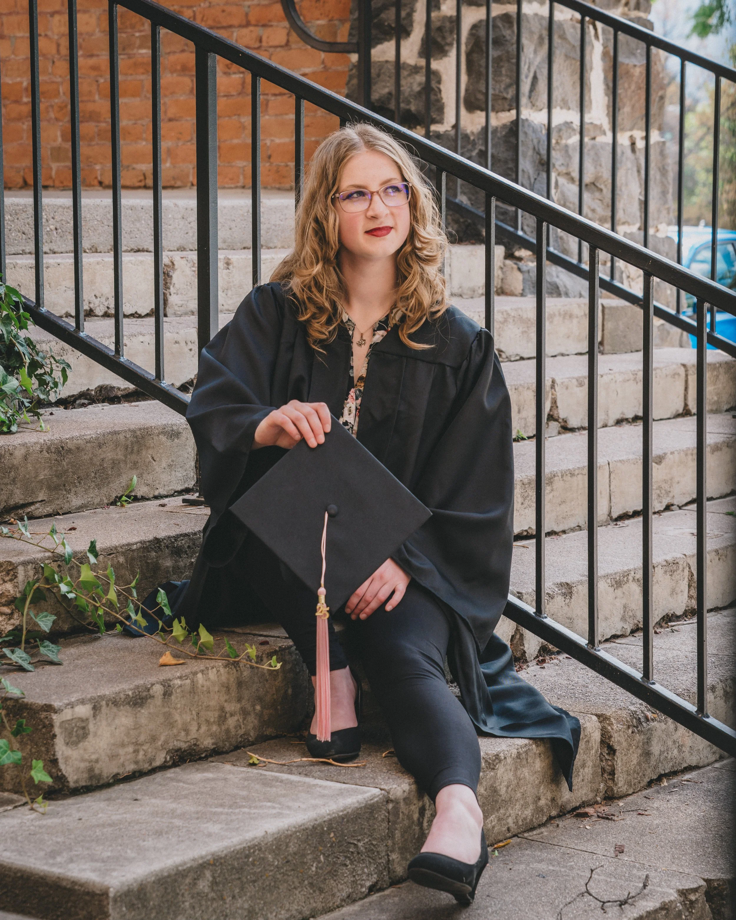women sitting on the steps on campus at Idaho state university in pocatleeo idaho by a local photographer from pocatello campbell photography