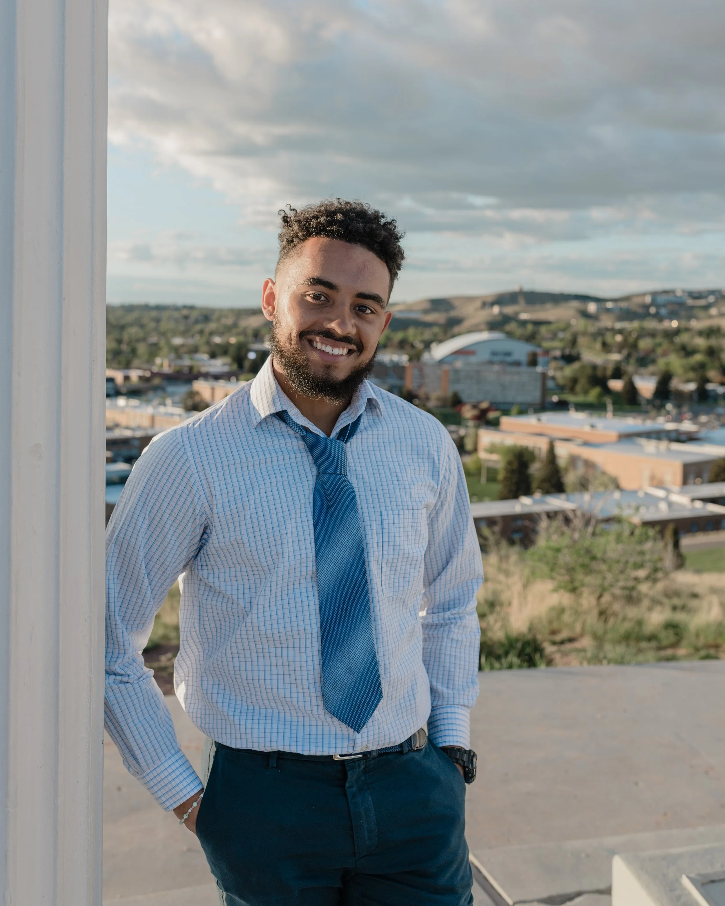 man in a suit and tie graduation at idaho state university