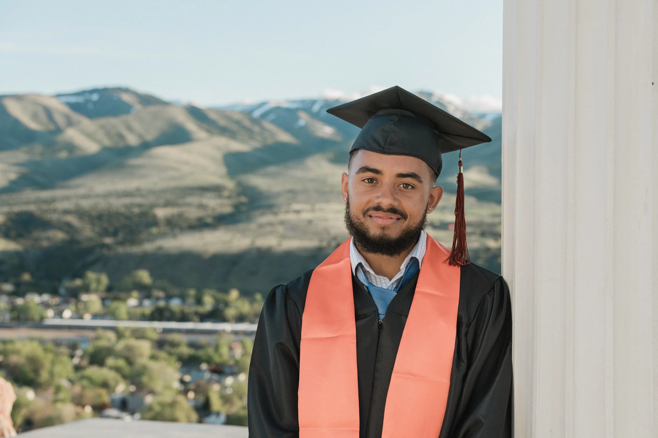 man graduating at idaho state university in cap and gown isu