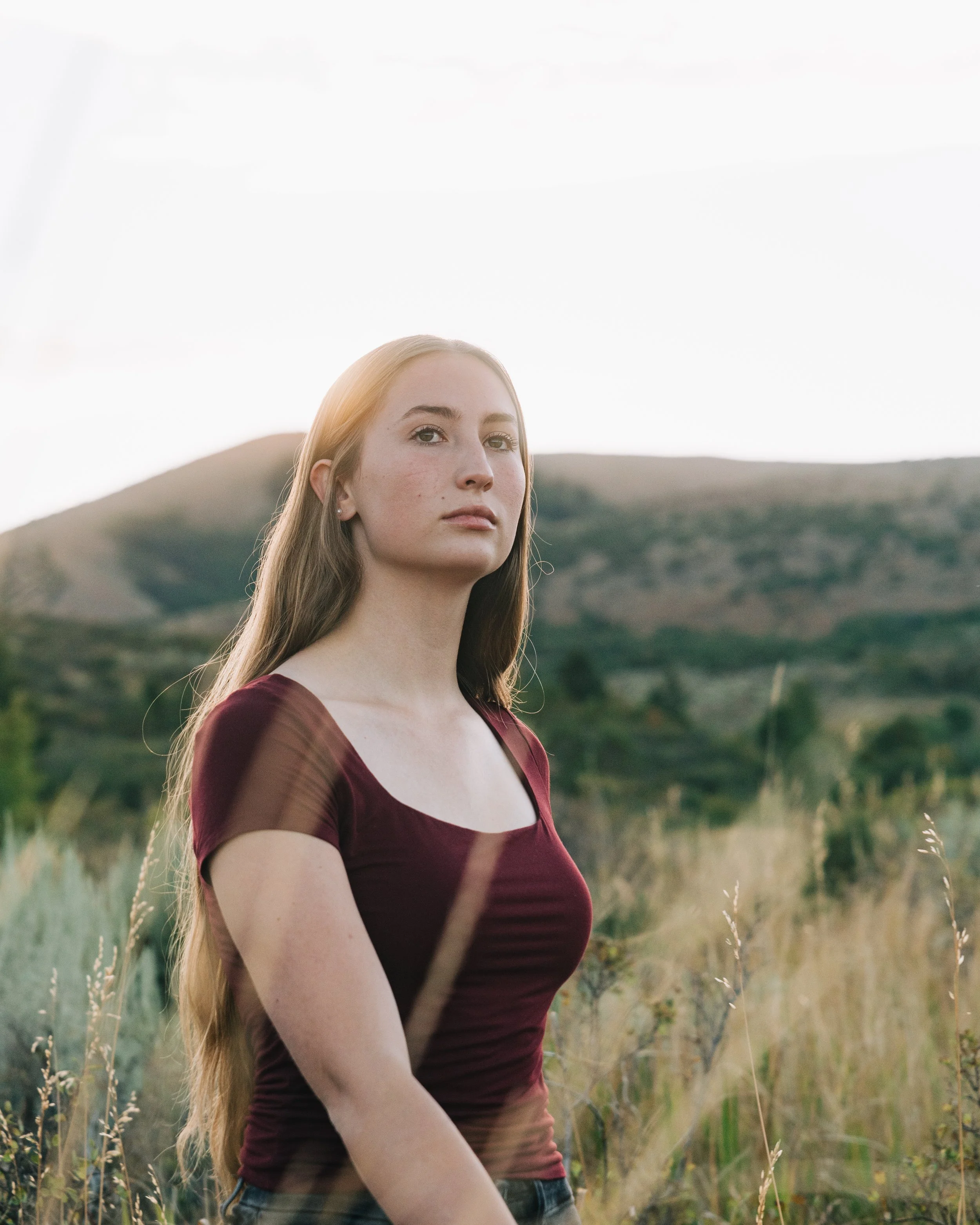 model walking though a field of tall grass in pocatello Idaho