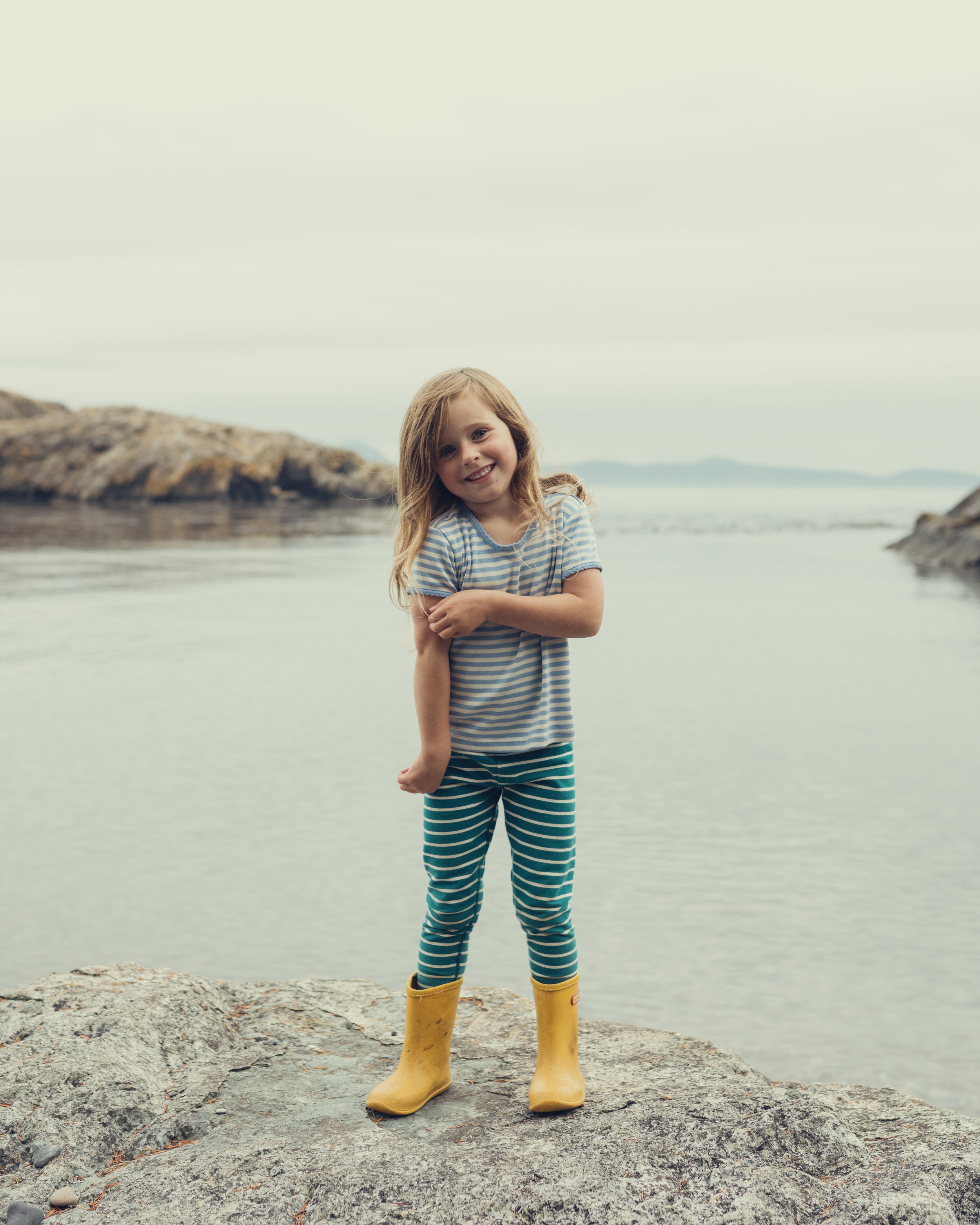 a picture of a kid by the ocean on Lopez island Washington by local pocatleeo photographer campbell photography