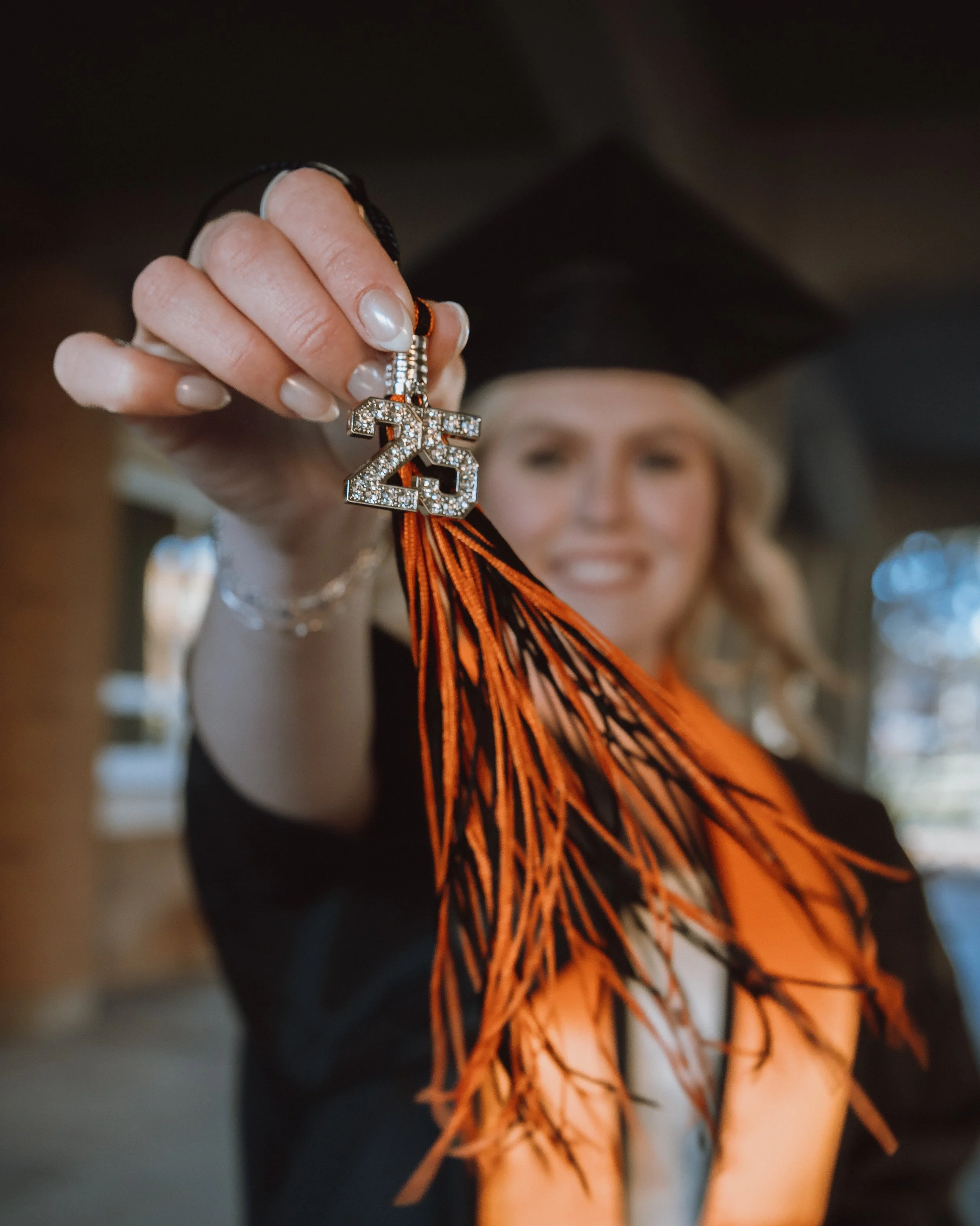 women at Idaho state university getting grad phots done