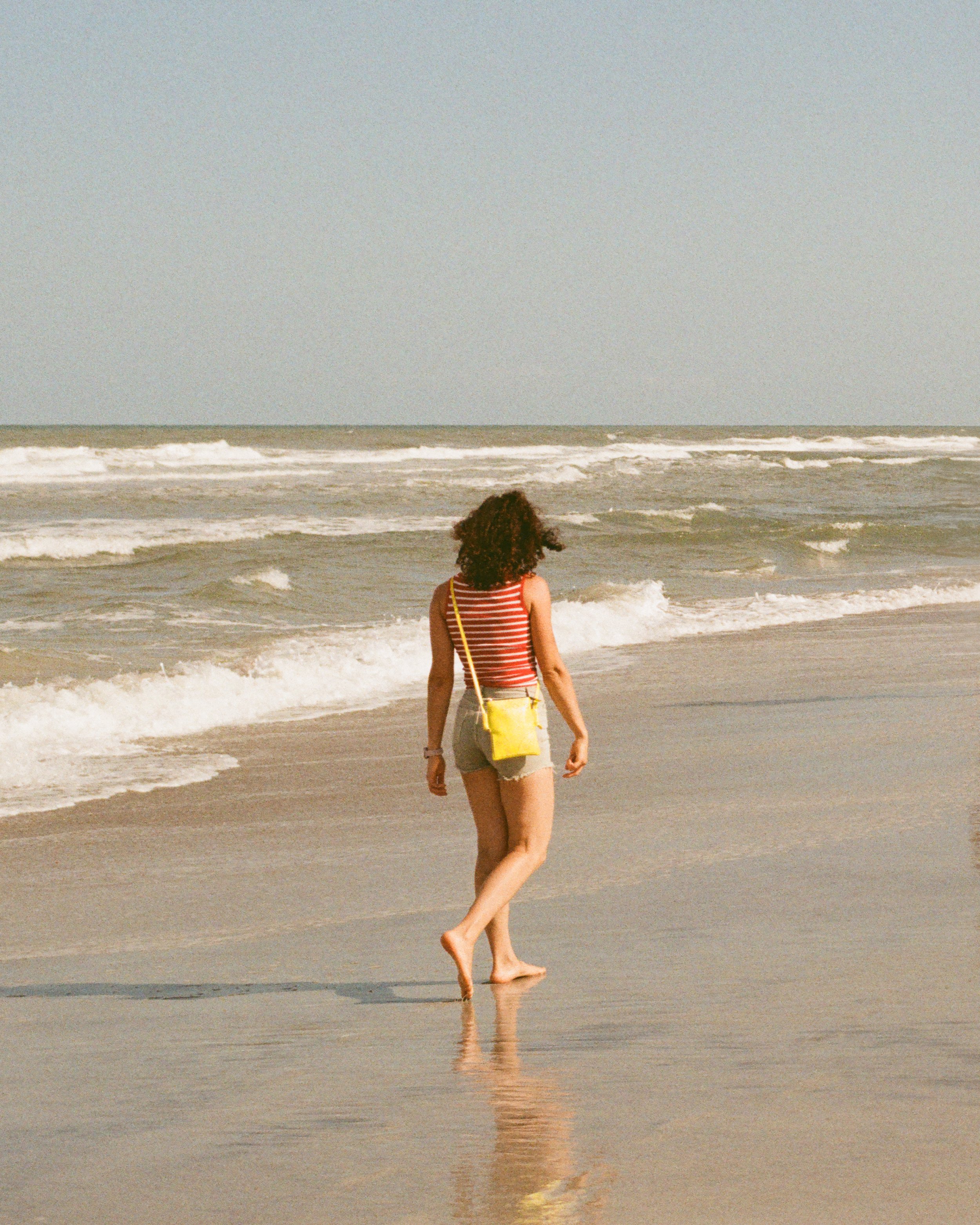 picture of a women walking on the beach in st Augustine Florida taken by campbell photography from pocatello idaho