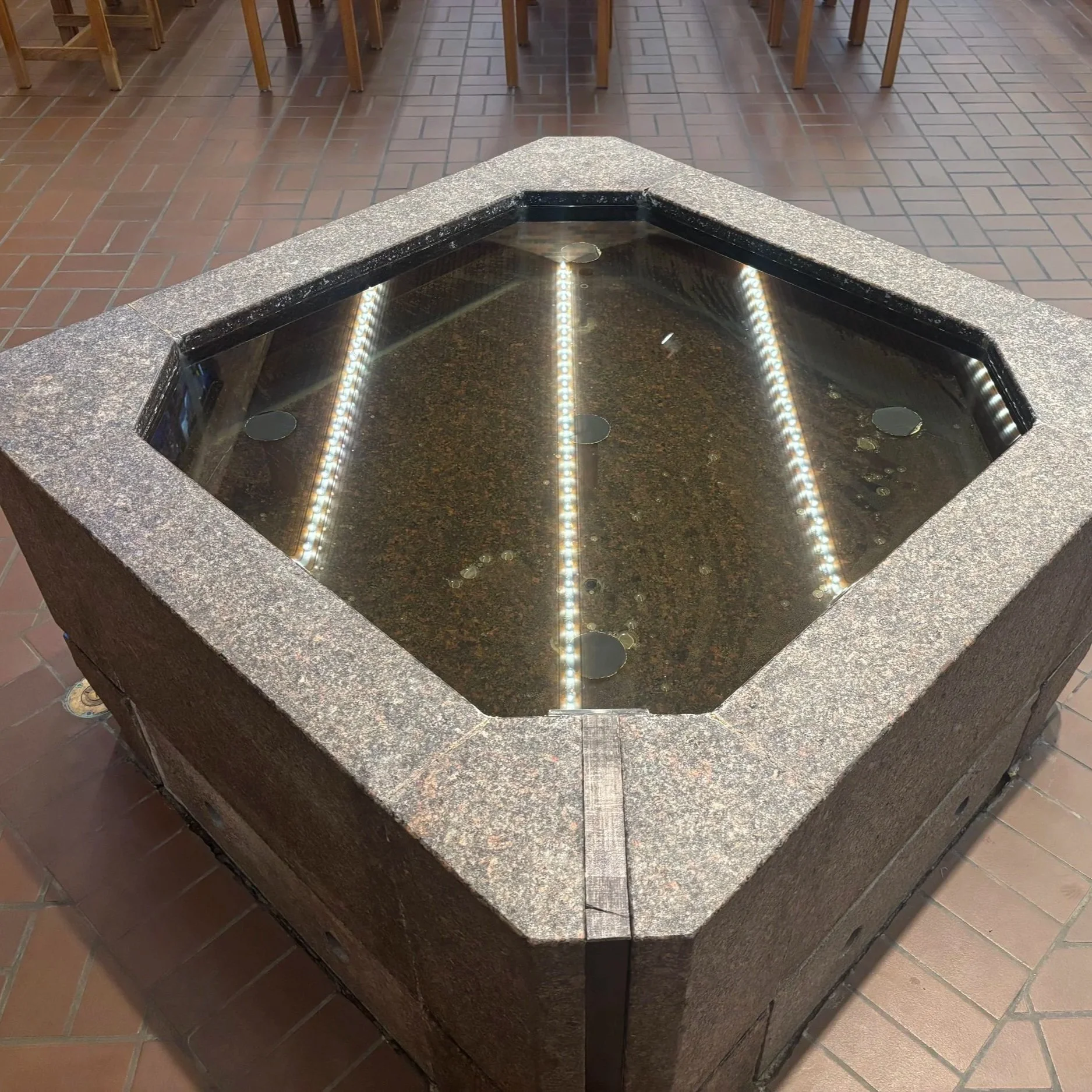 Why do baptismal fonts have eight sides?