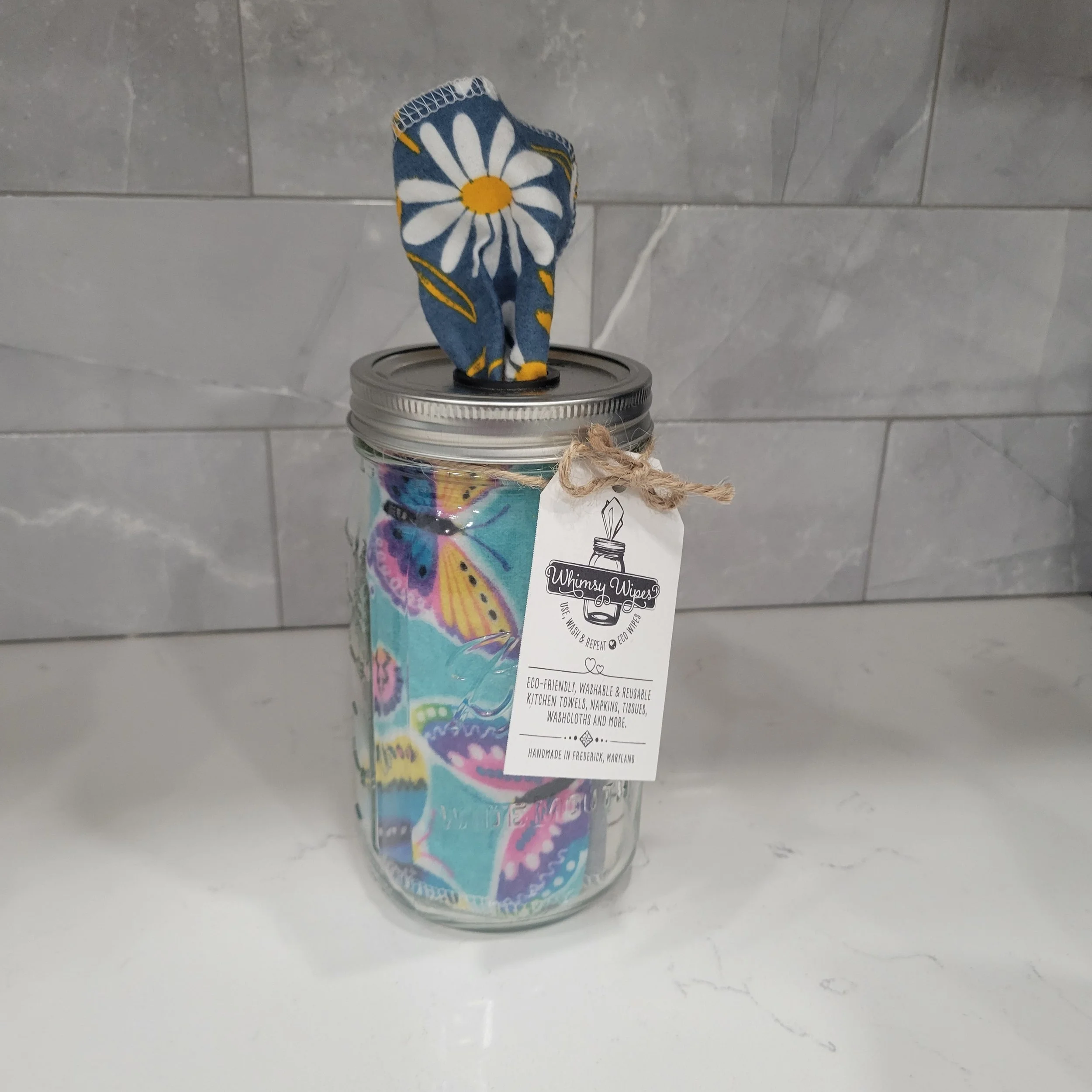 Whimsy Wipes Quart Tissue Jar with daisy wipe showing