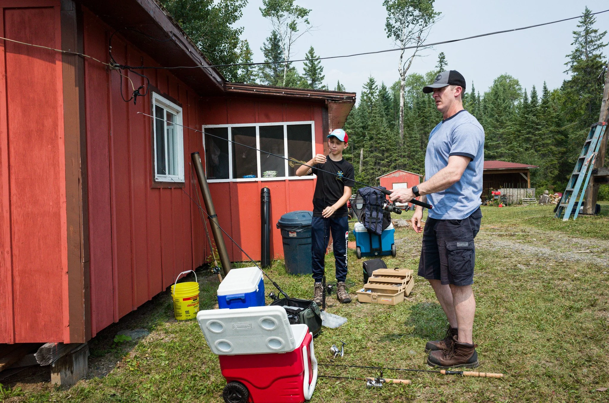 Cameron and Mark preparing their fishing rods