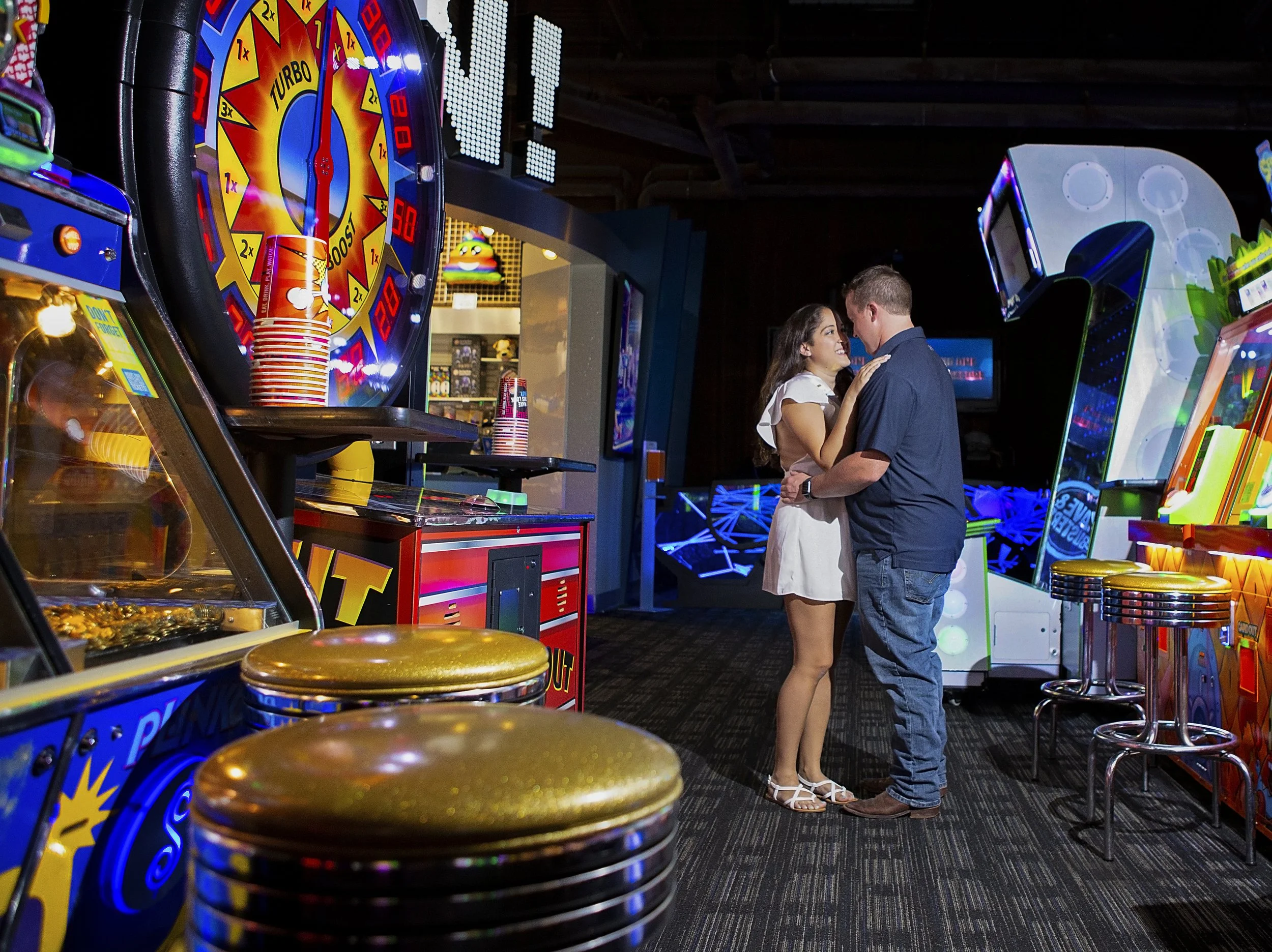 Bridal announcement session in an arcade. 