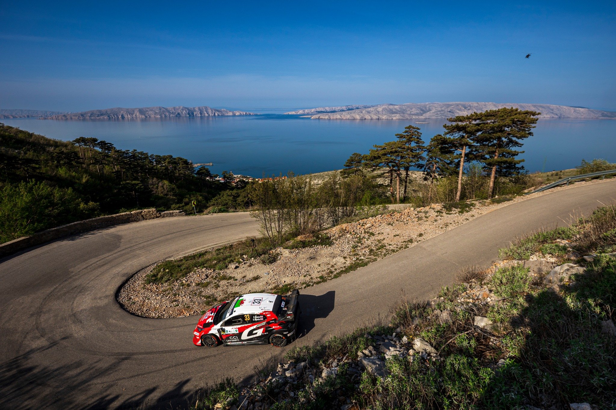 Worth the hike.

Elfyn Evans and Scott Martin with the Toyota GR Yaris Rally1 navigating a mountain hairpin at Rally Croatia 2026, high above with the sea stretching out in the background.

📸 Marco Rimola
&copy;️ Pure WRC Agency
&copy;️ Marco Rimola