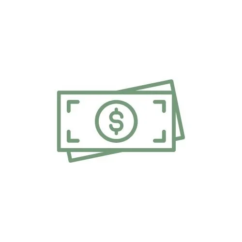 A stack of US dollar bills, including a visible $100 bill, on a wooden surface.