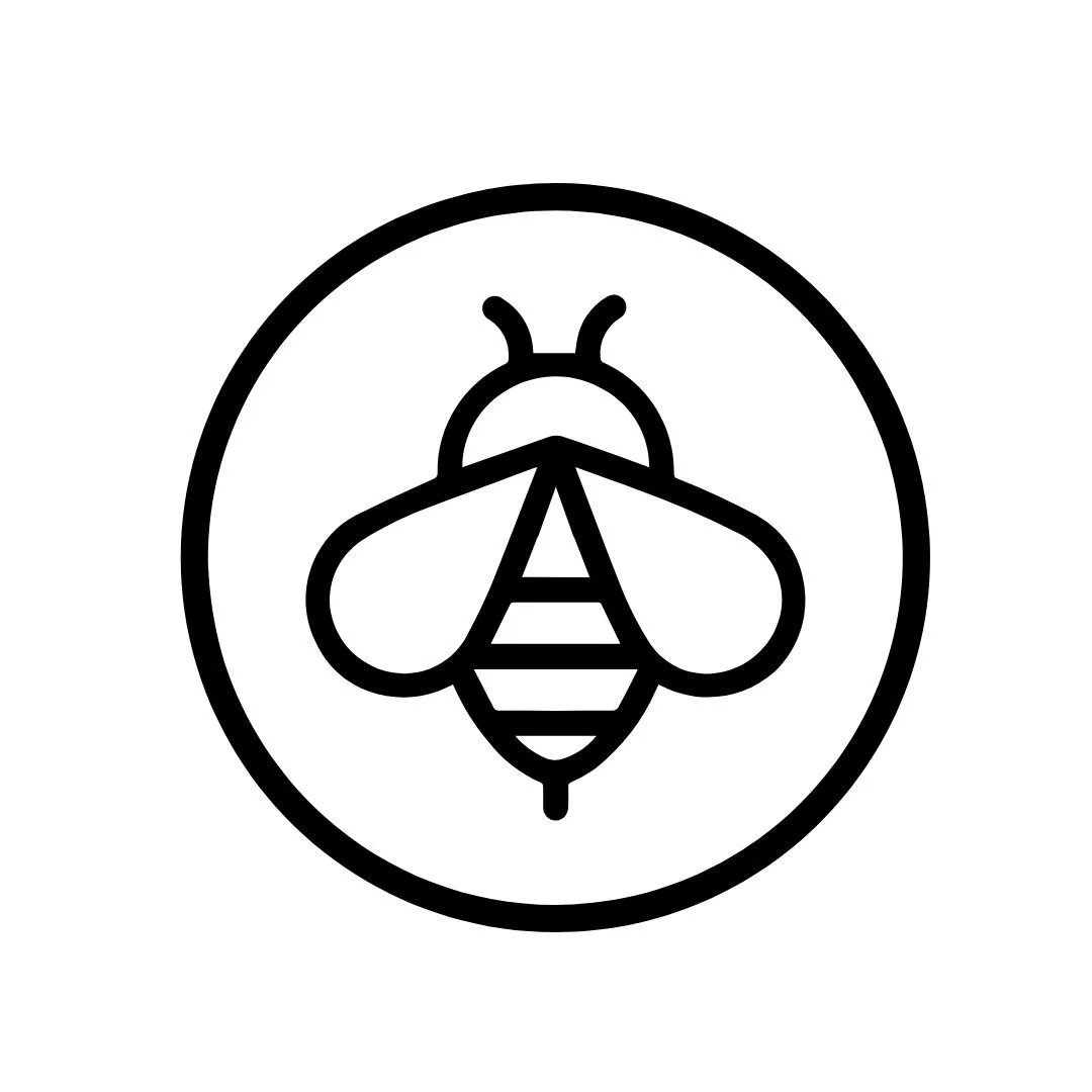 A black outline illustration of a bee inside a circle.