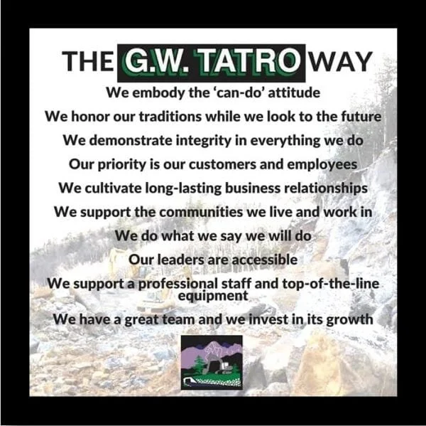 A poster titled "The G.W. Tatro Way" with statements about company values, including integrity, customer and employee focus, community support, leadership accessibility, teamwork, and growth.