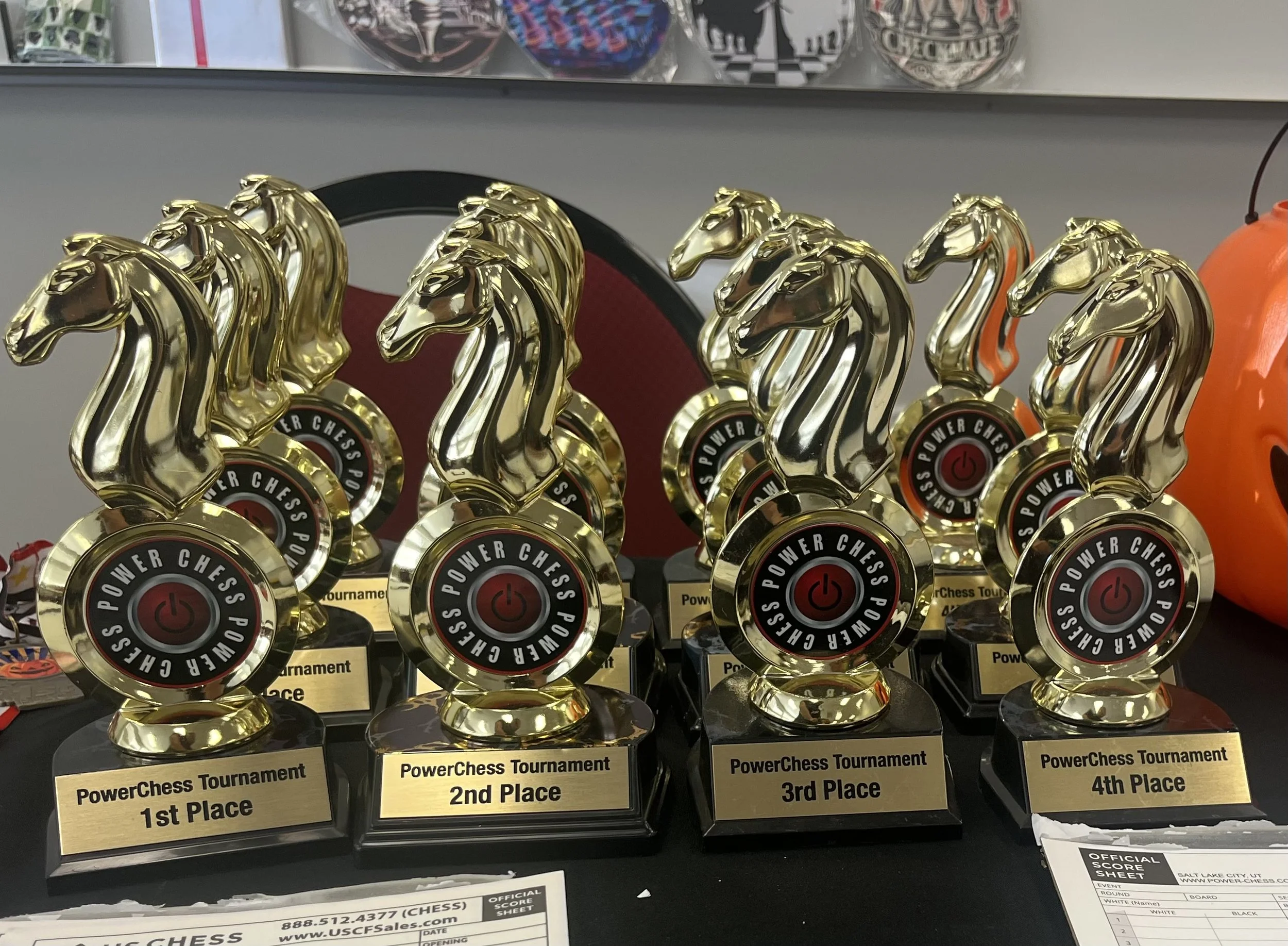 Schedule of monthly Powerchess tournaments in 2025 with dates, times, and locations at Miller Conference Center in Sandy, Utah. Includes a red background with chess imagery and logo.