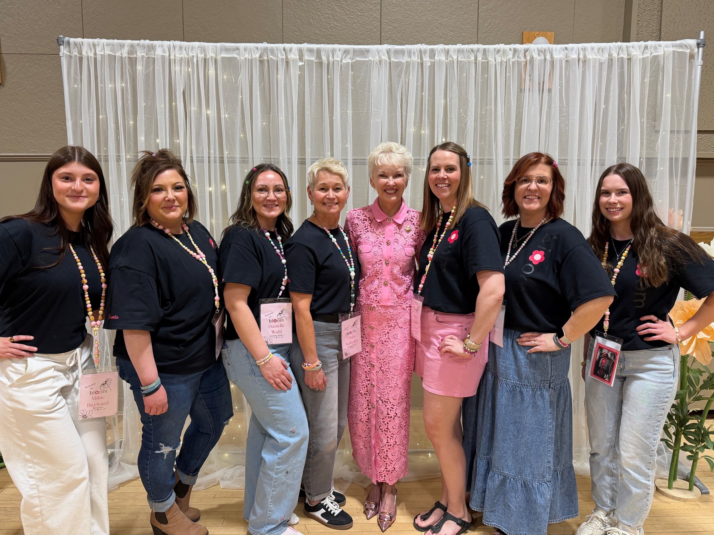 women in black T-shirts with LG McIntyre in Weyburn - May 9, 2026.jpg