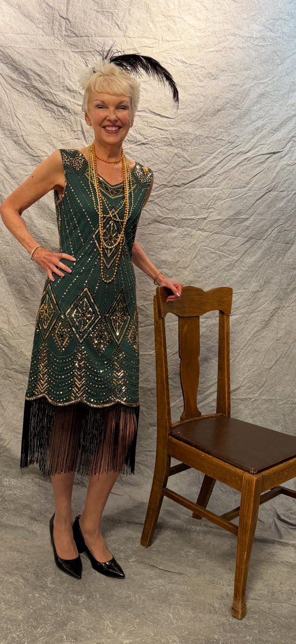 LG McIntyre in green flapper dress - May 9, 2026.png