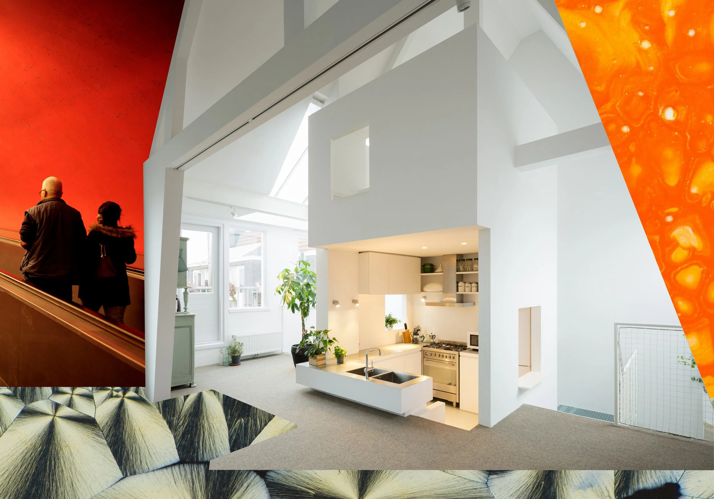 A modern, open-plan kitchen and living space with white walls, plants, and natural light. There are two people walking up a staircase, with a large, colorful, abstract wall art piece partially visible on the right.