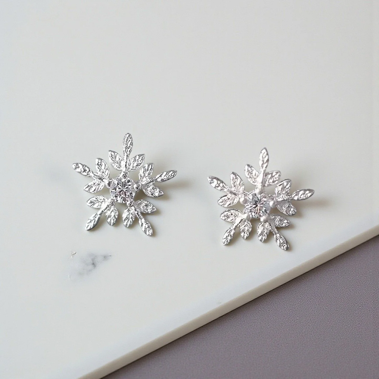 Our Snow 925 Sterling Silver Studs sparkle with every turn &mdash; the perfect touch of frosty glamour for the season. ❄️
Handcrafted with premium 925 sterling silver, designed to shine beautifully in every moment.

Available now at LAURR&Egrave;.
Tr