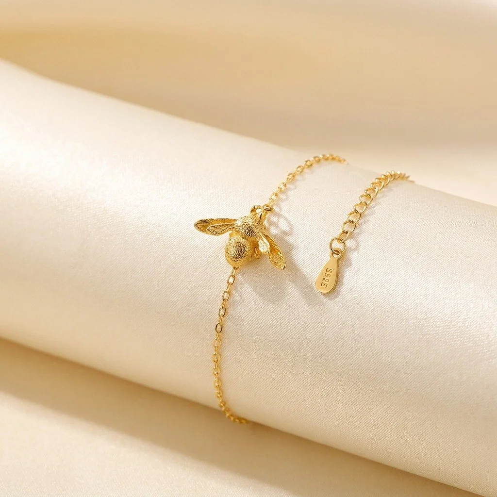 Summer vibes + golden details ✨🐝

Our bee bracelet is crafted from 925 sterling silver, beautifully 18K gold plated, and designed with an adjustable fit for everyday comfort 💛 Lightweight, elegant, and perfect for sunny days, summer outfits, and go