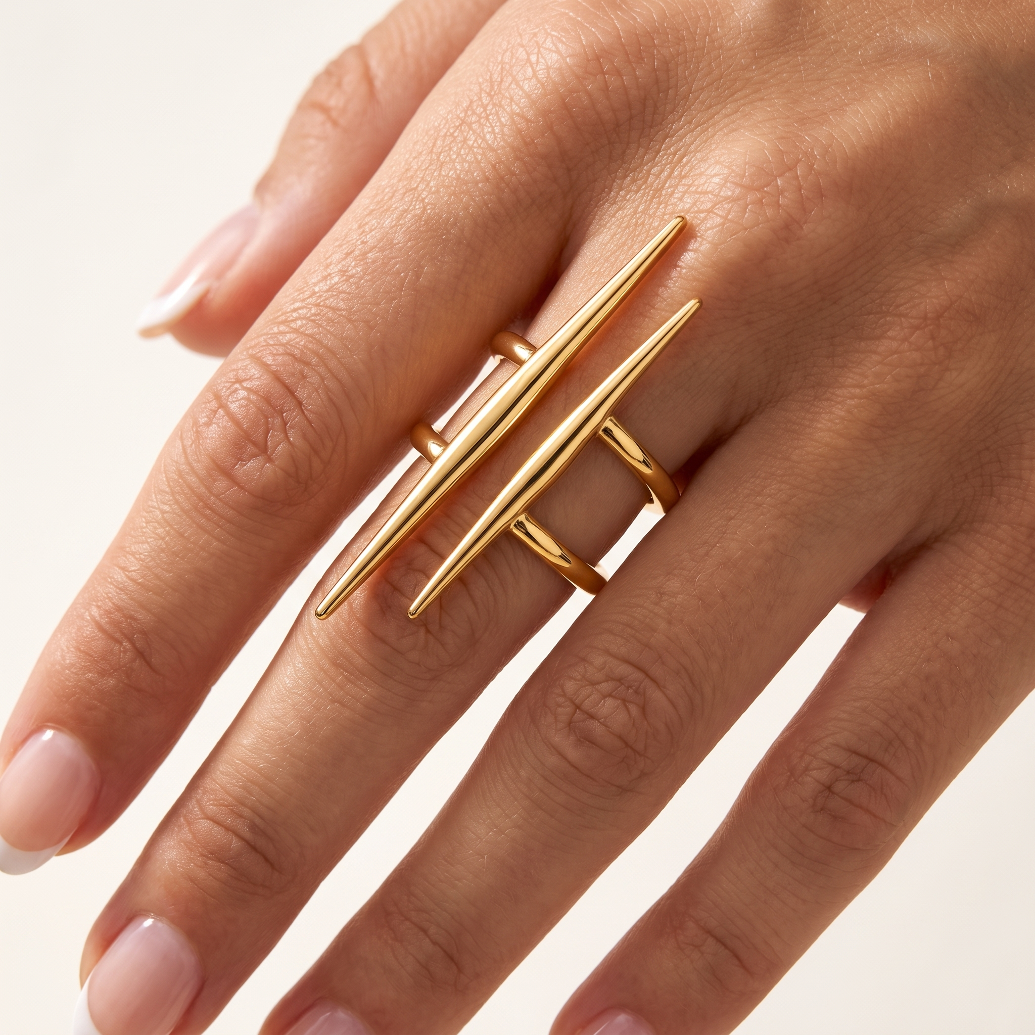 Close-up of Sculpté adjustable 18K gold plated stainless steel ring with long geometric double band design worn on hand