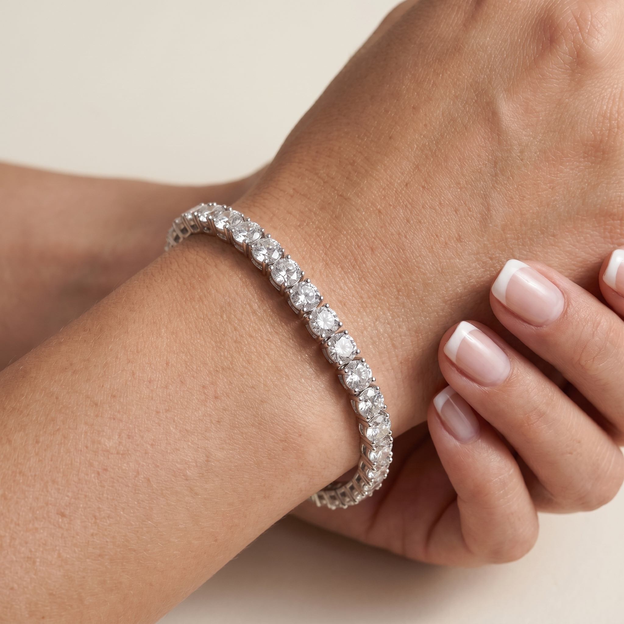 Silver plated tennis bracelet worn on wrist showing size and sparkle