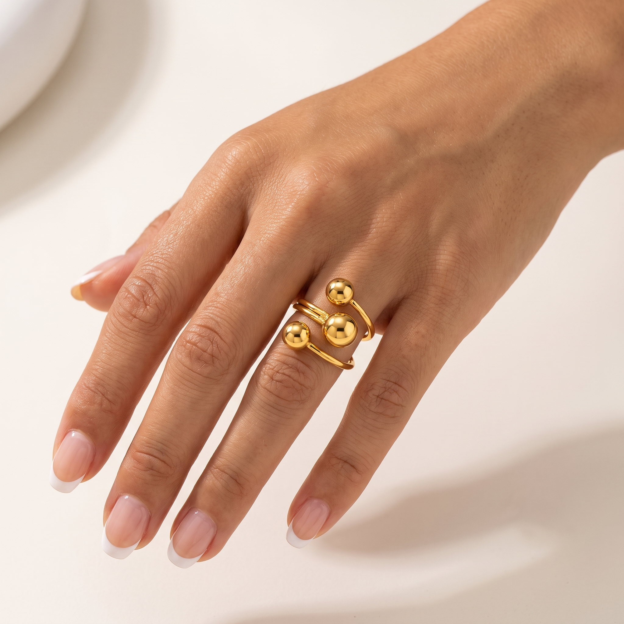 Orbelle waterproof adjustable gold ring for women with sculptural three sphere design worn on hand