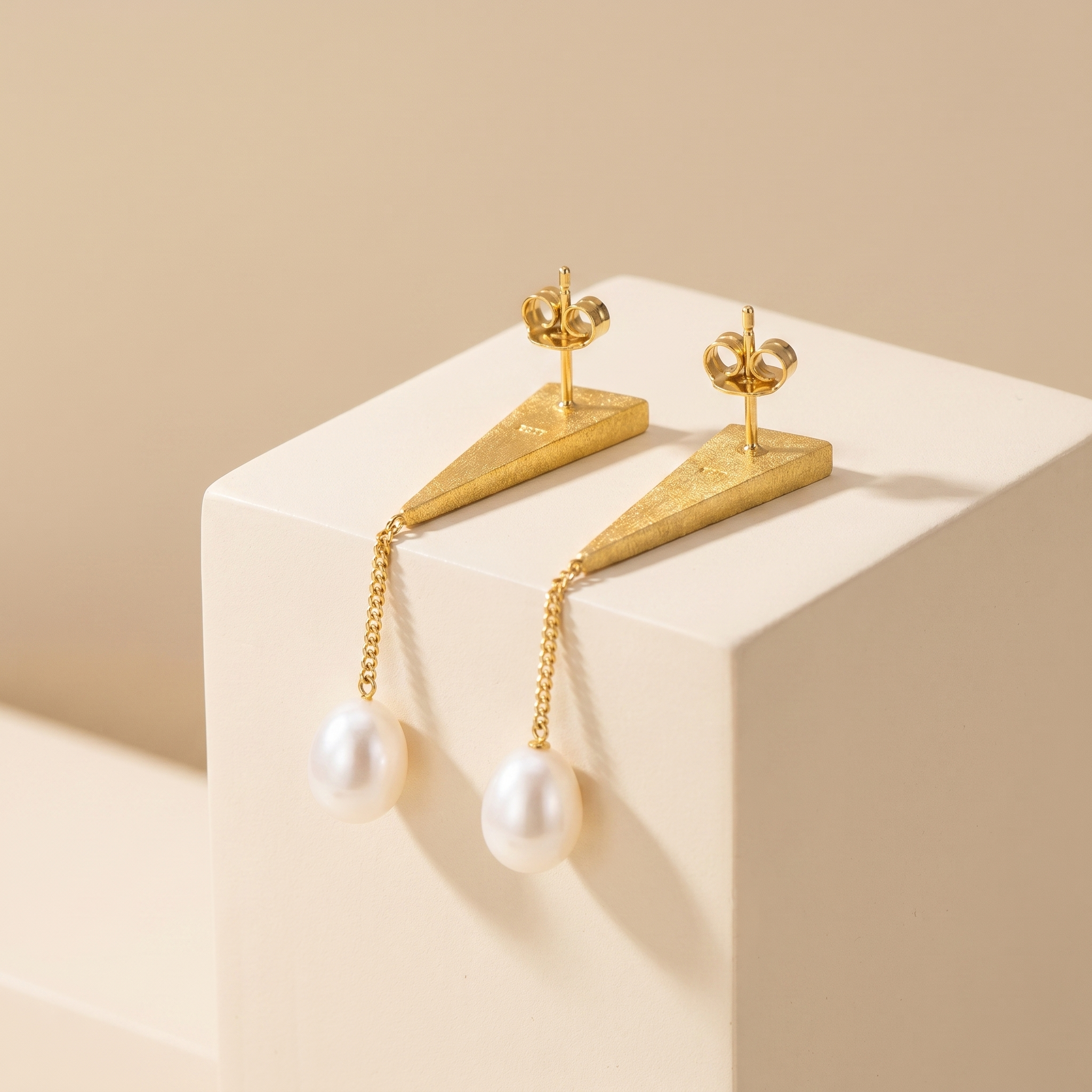 Back view of gold plated 925 sterling silver pearl drop earrings with secure stud fastening