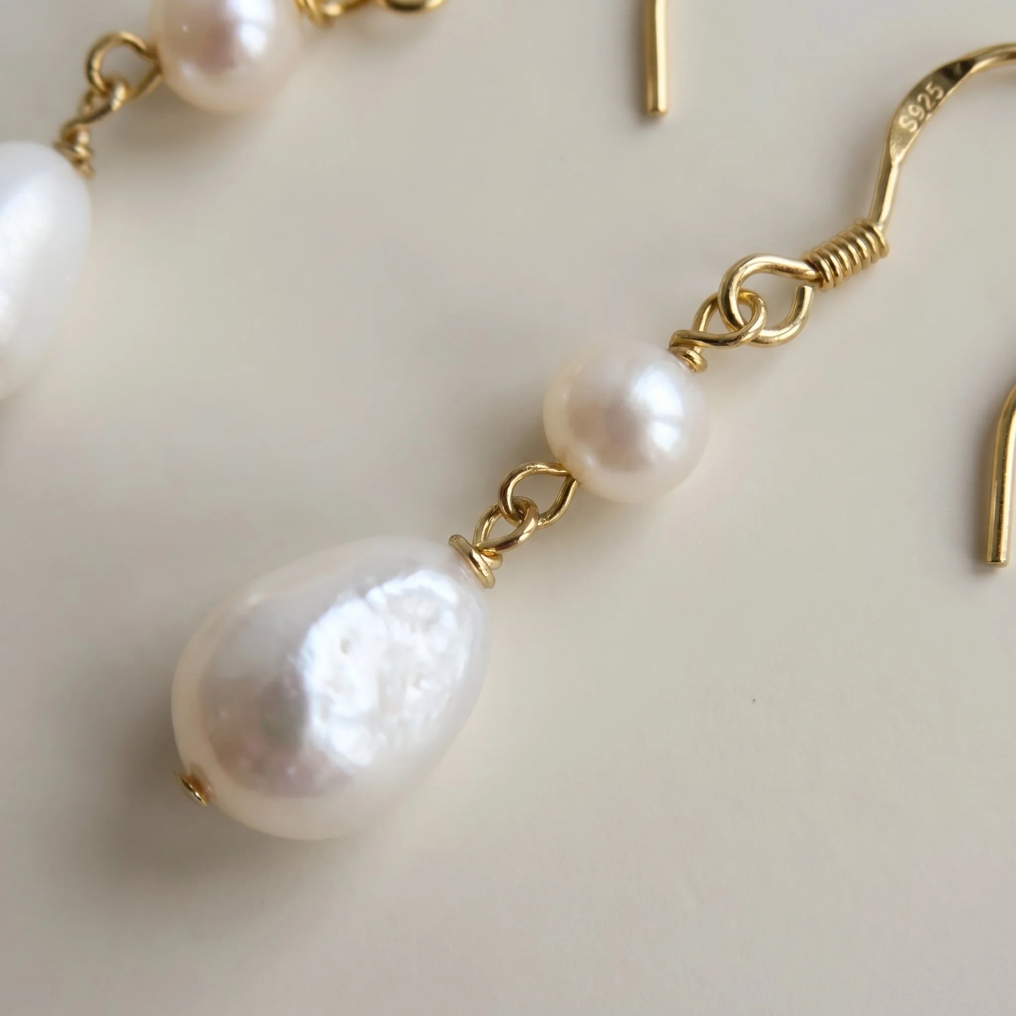 Macro close-up of freshwater baroque pearl drop earrings with S925 hooks