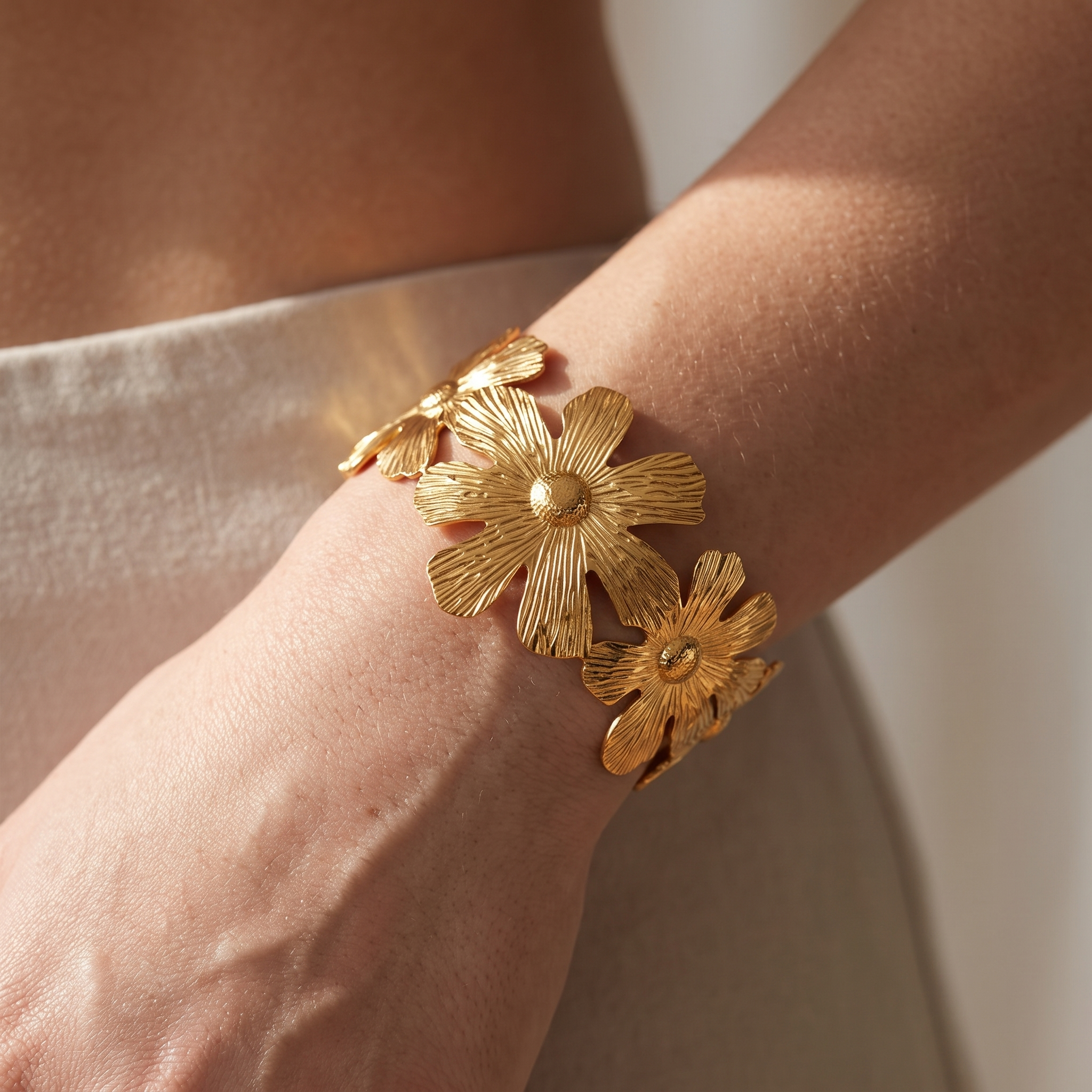 Woman Wearing Gold Flower Cuff Bracelet | Waterproof Gold Plated Stainless Steel Statement Jewellery