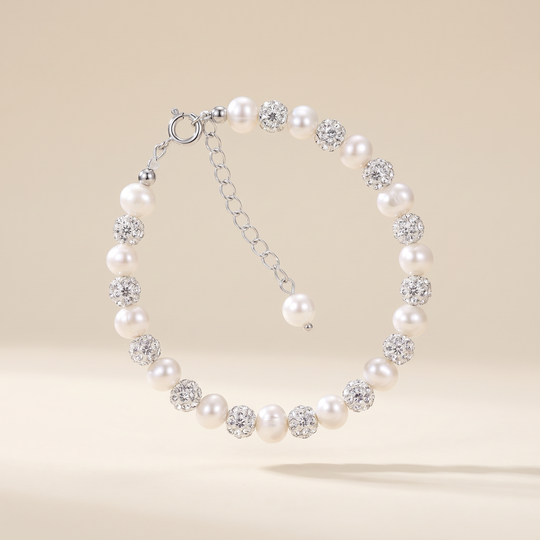 White freshwater pearl and clear cubic zirconia bracelet in 925 sterling silver with adjustable extension chain, LAURRÈ Jewellery.