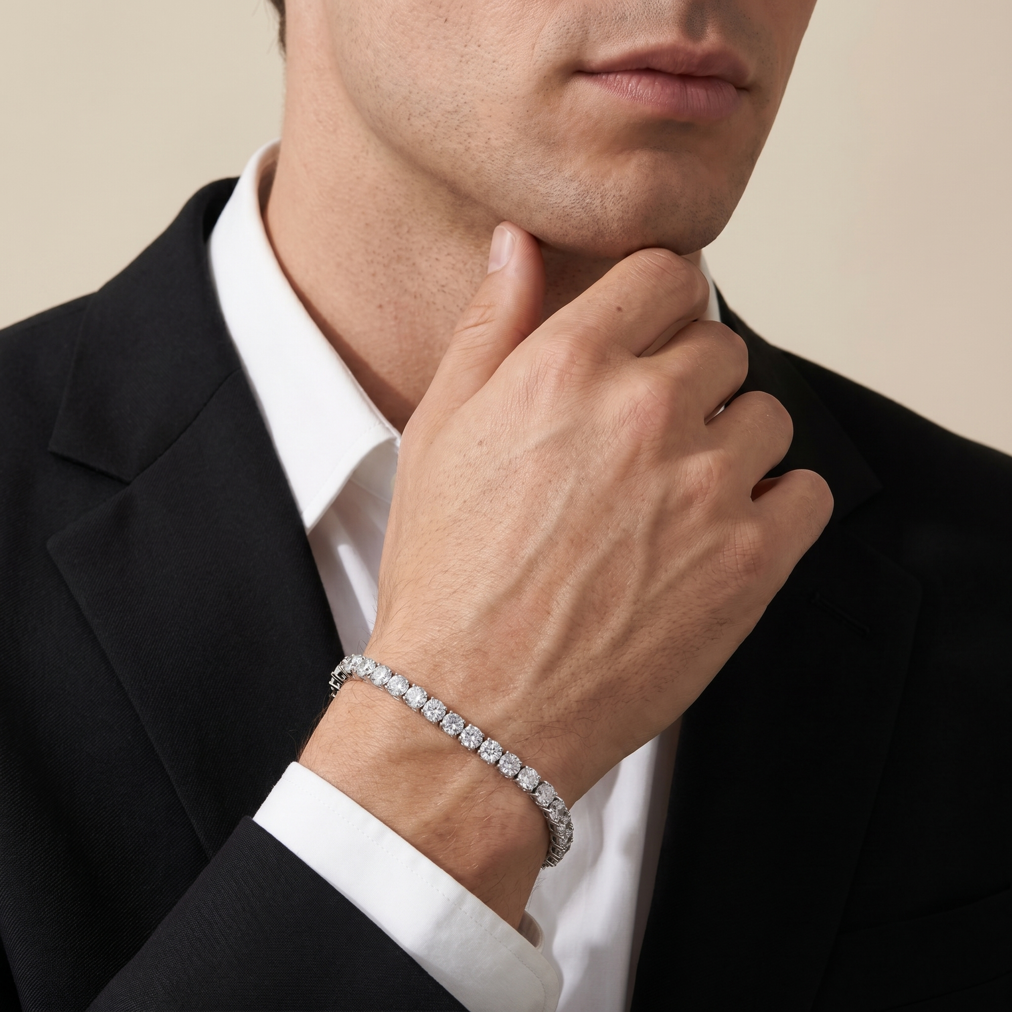 Luxury men's silver tennis bracelet styled with black suit and white shirt