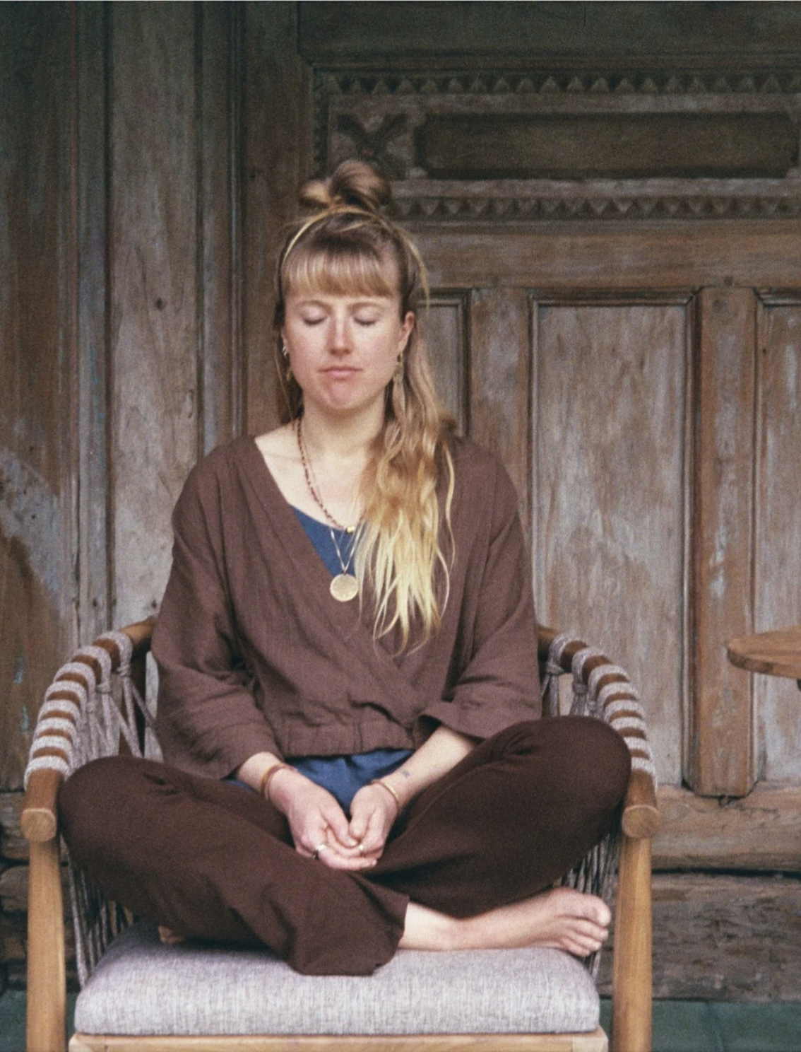 Kathleen O’Brien meditating with eyes closed during a Bali retreat.