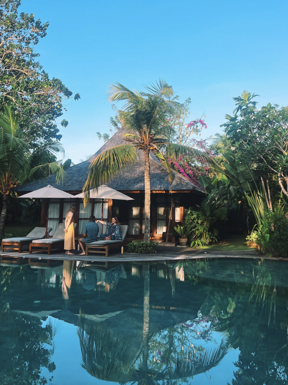 Women spending time together by the pool during a Bali meditation retreat