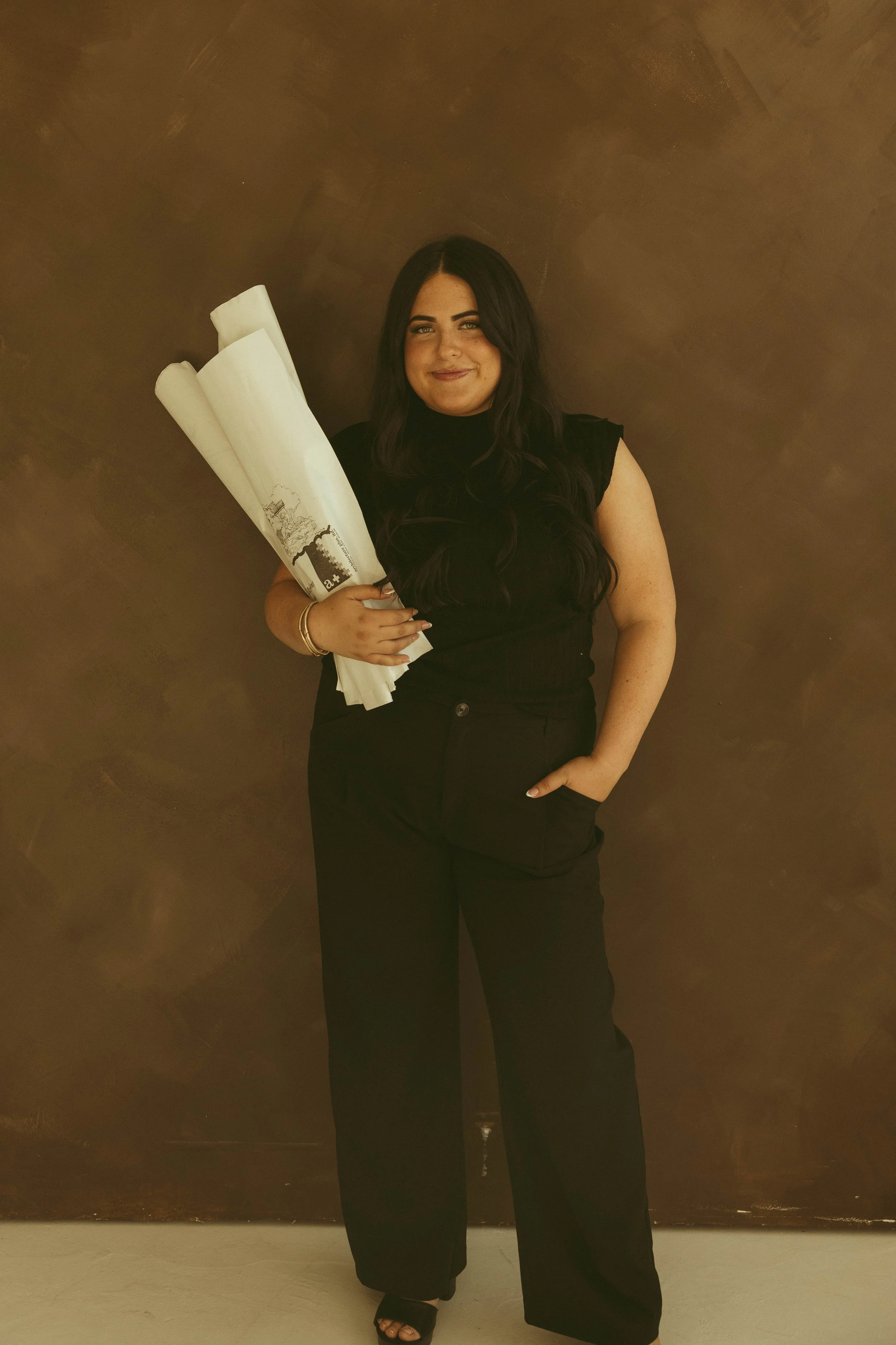 principal designer jaydin nielsen holding flowers for nita and hearth interior design studio in scottsdale arizona