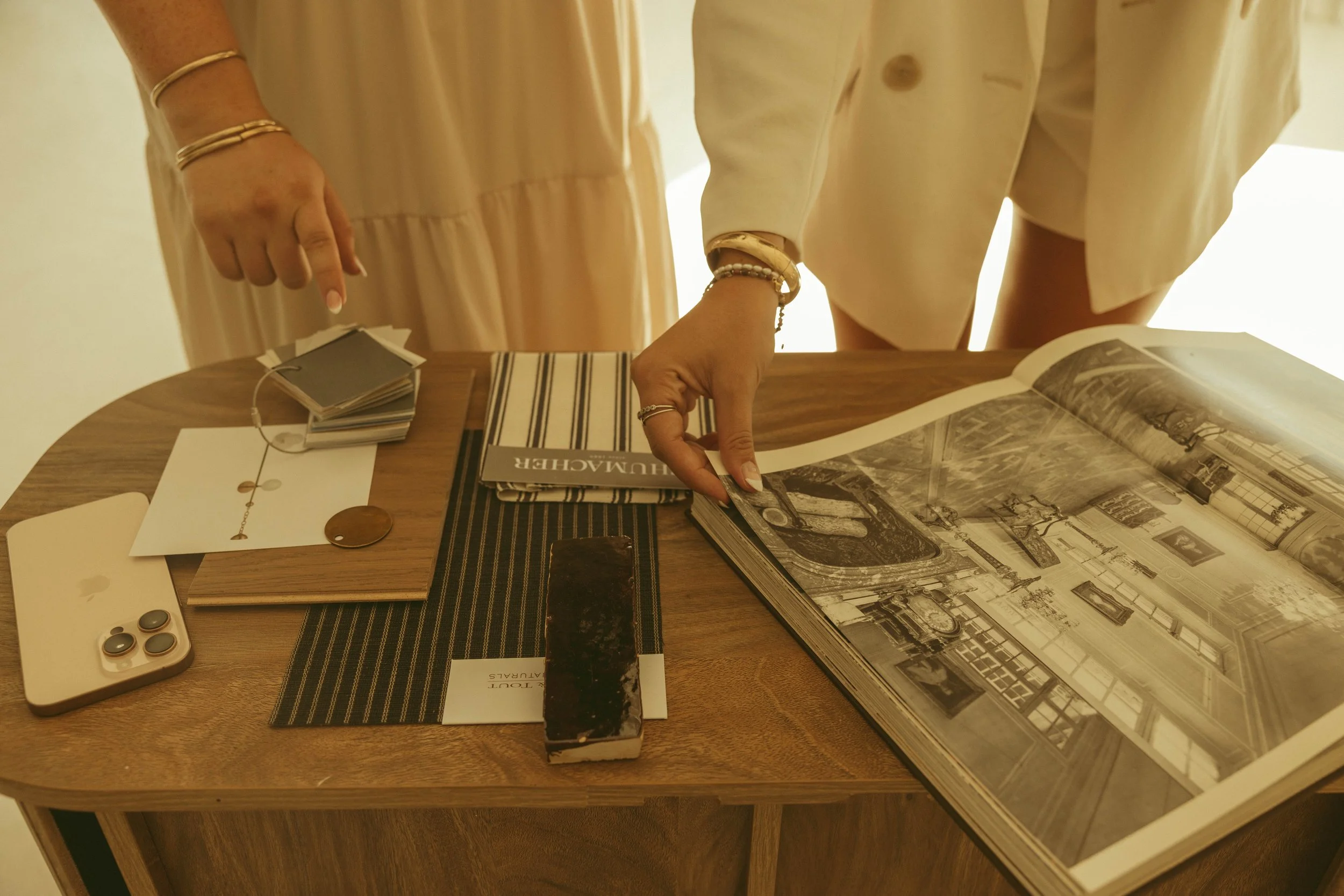 interior designers reviewing materials and design plans for a luxury home project in scottsdale arizona