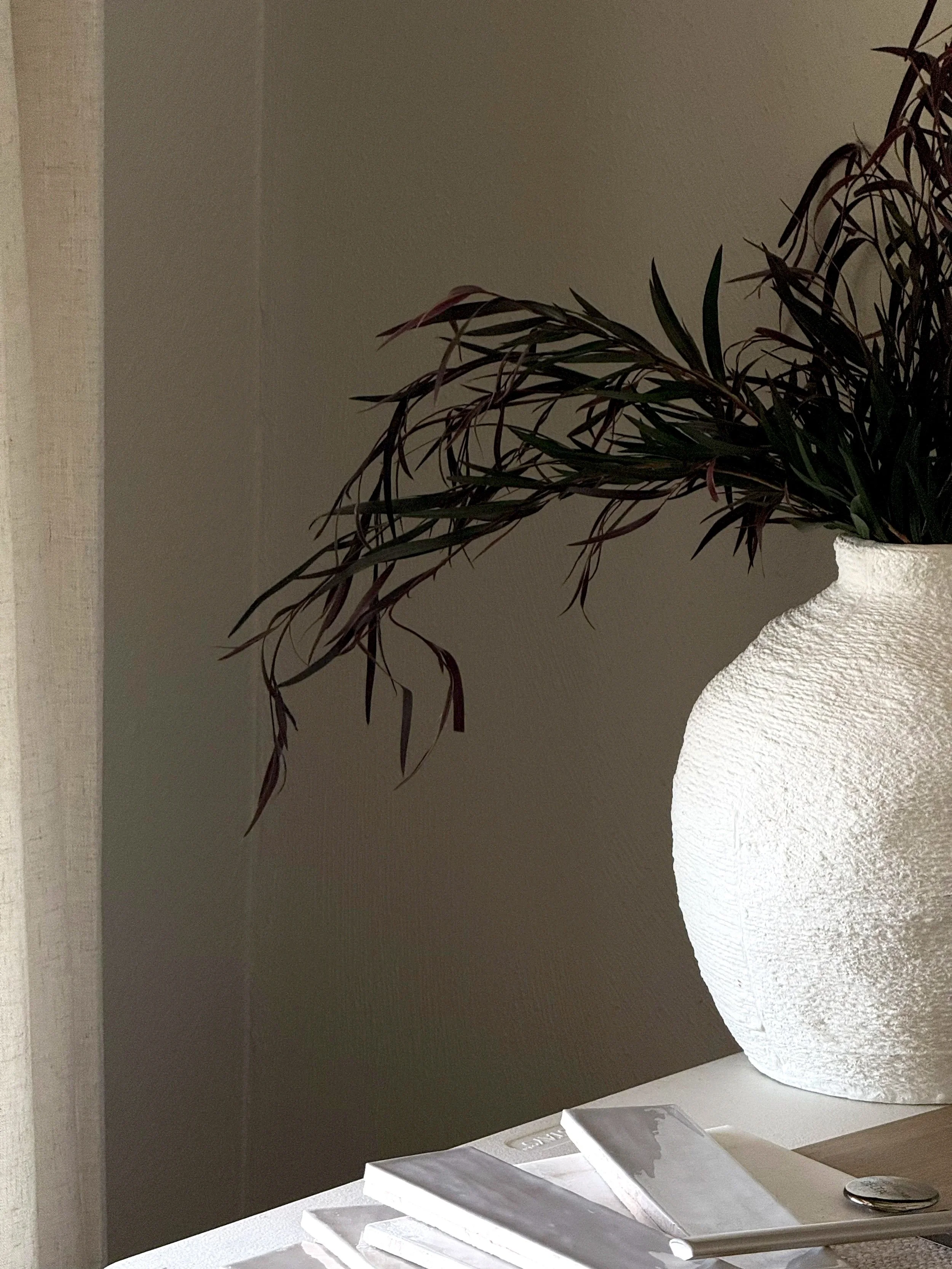 styled ceramic vase with greenery in a luxury interior design setting in scottsdale arizona