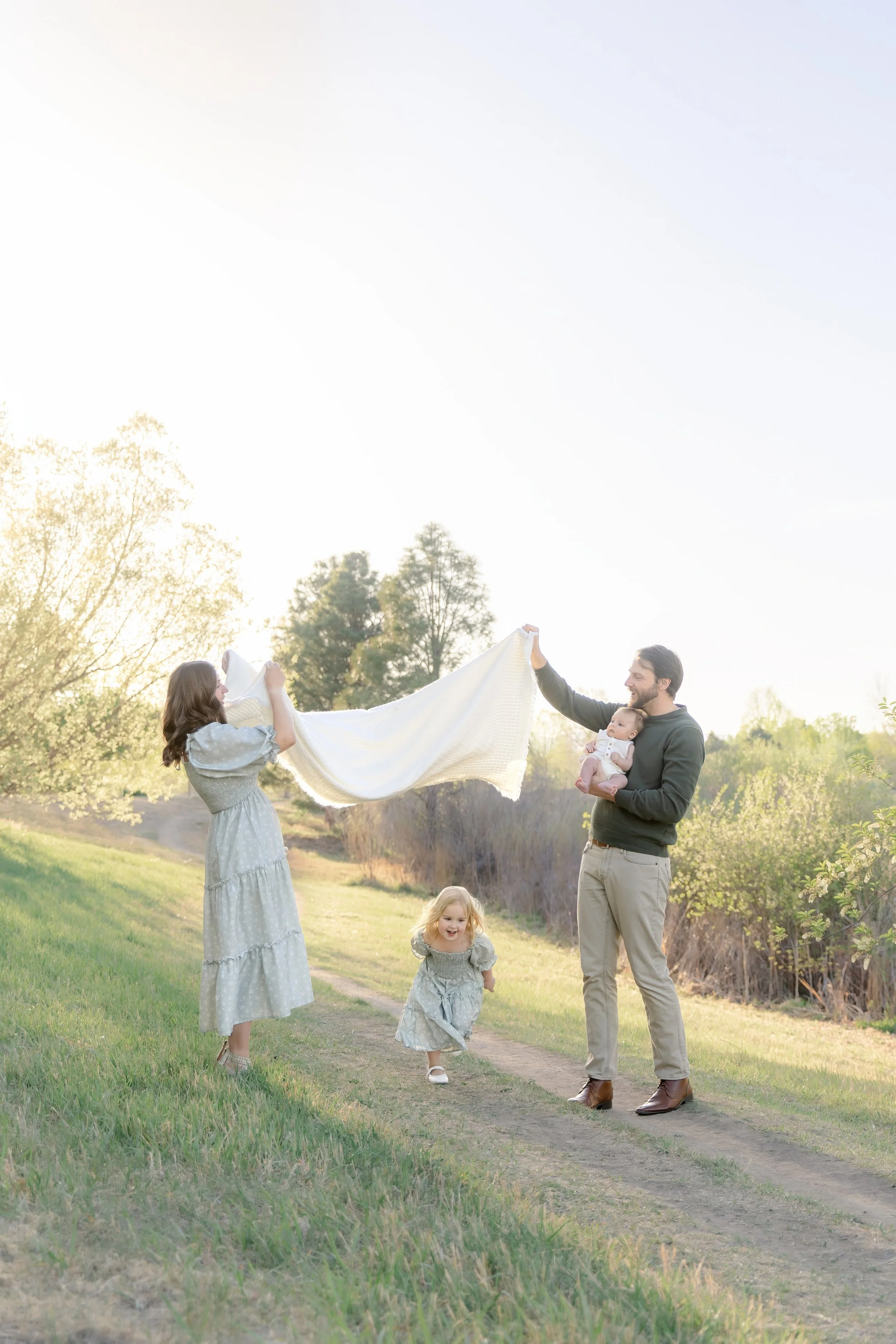 Family playing games during Fort Collins family photography session.
