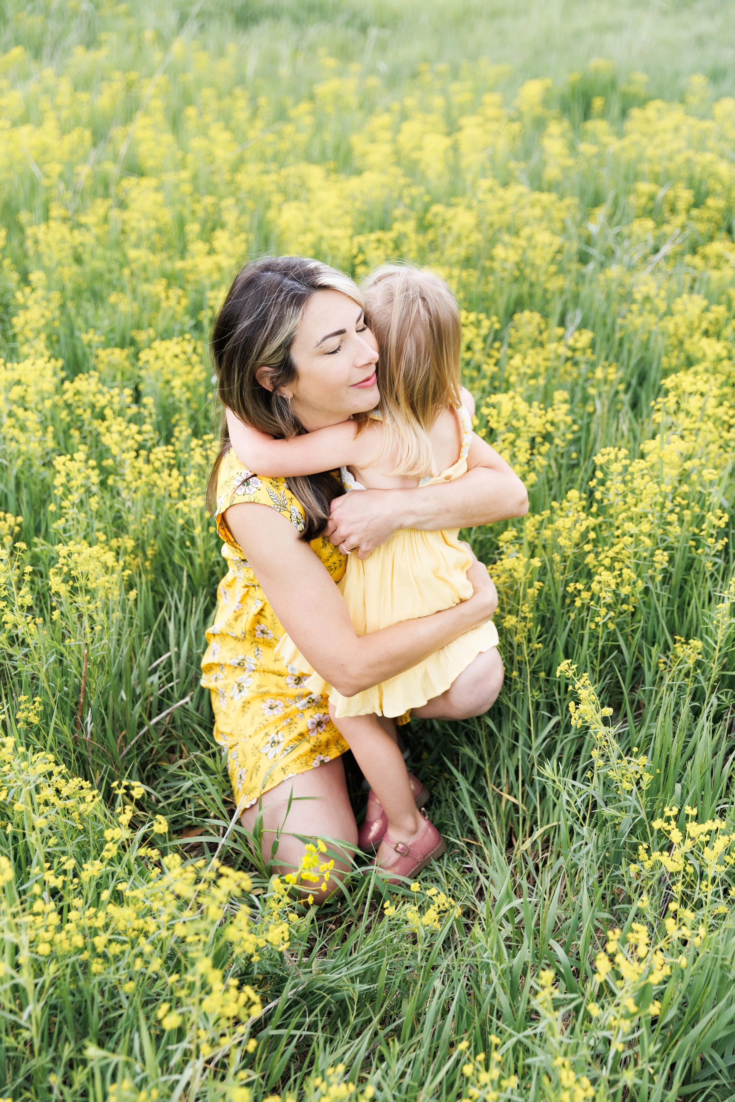 Family photo session with spring wildflowers in Fort Collins, CO