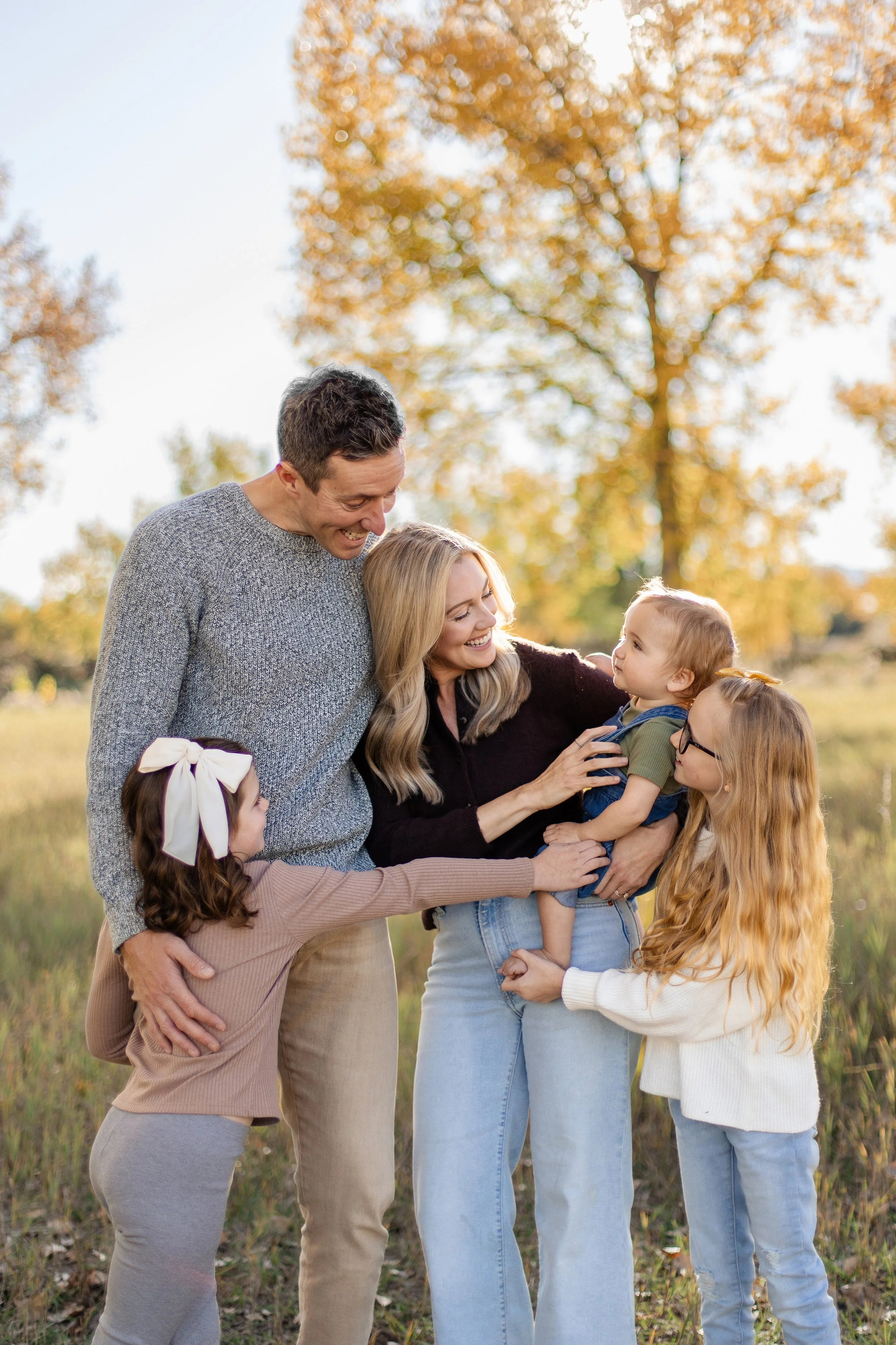 Candid family photo during a fall mini session in Fort Collins, Colorado